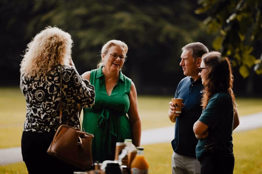Customers talking at an Adfin event