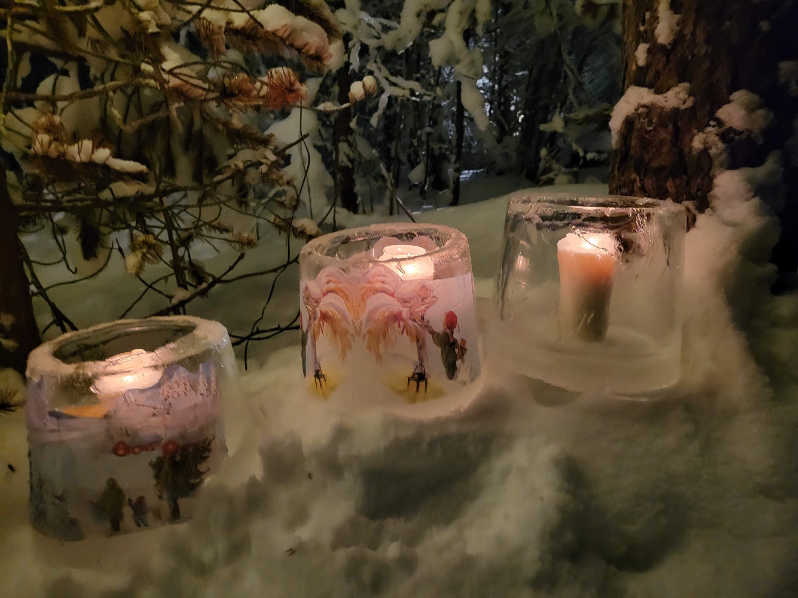 Lanterns glowing in the snow at the Tundra Huskies farm