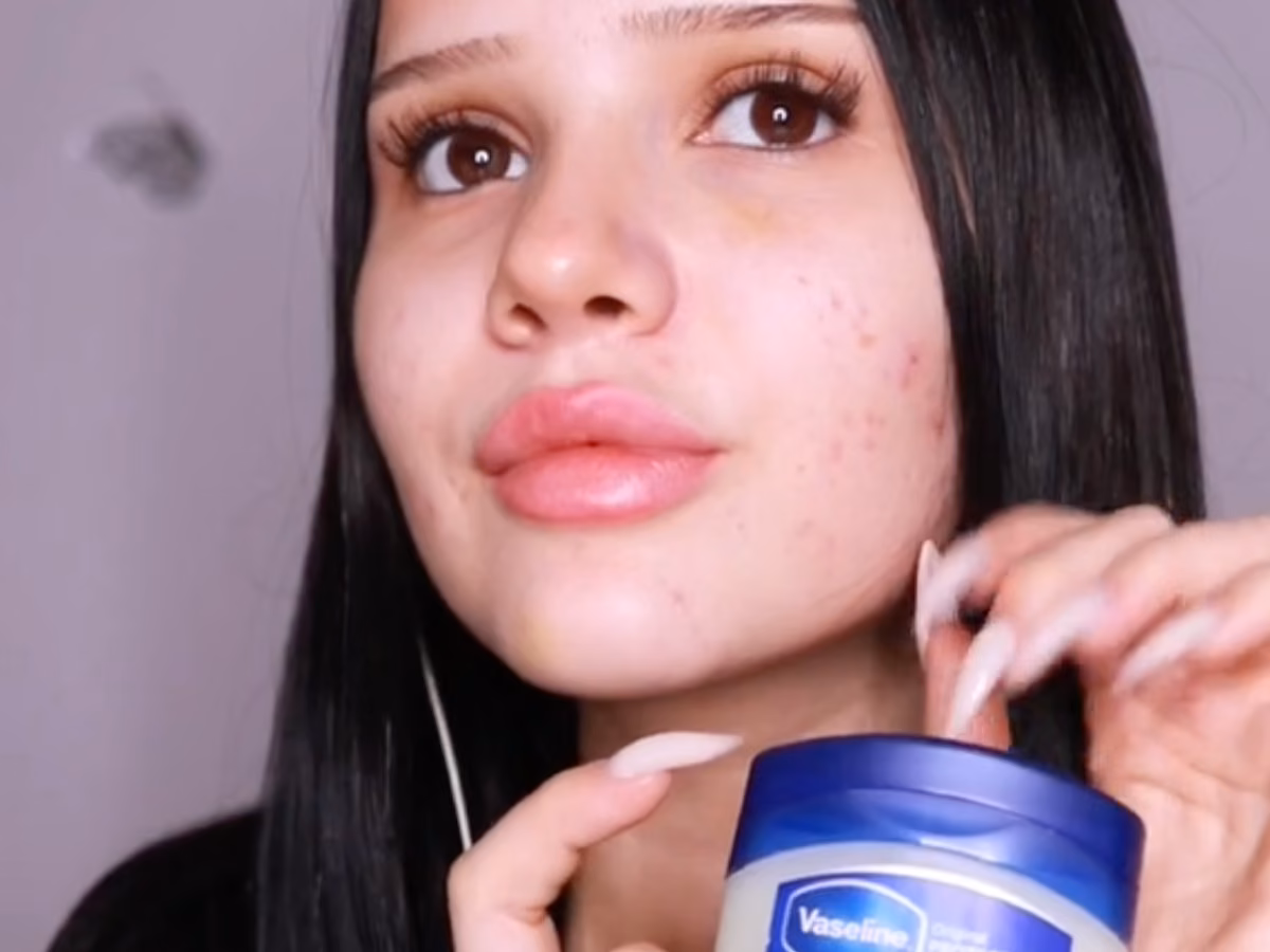 Creator holding a tub of Vaseline Original Petroleum Jelly for slugging