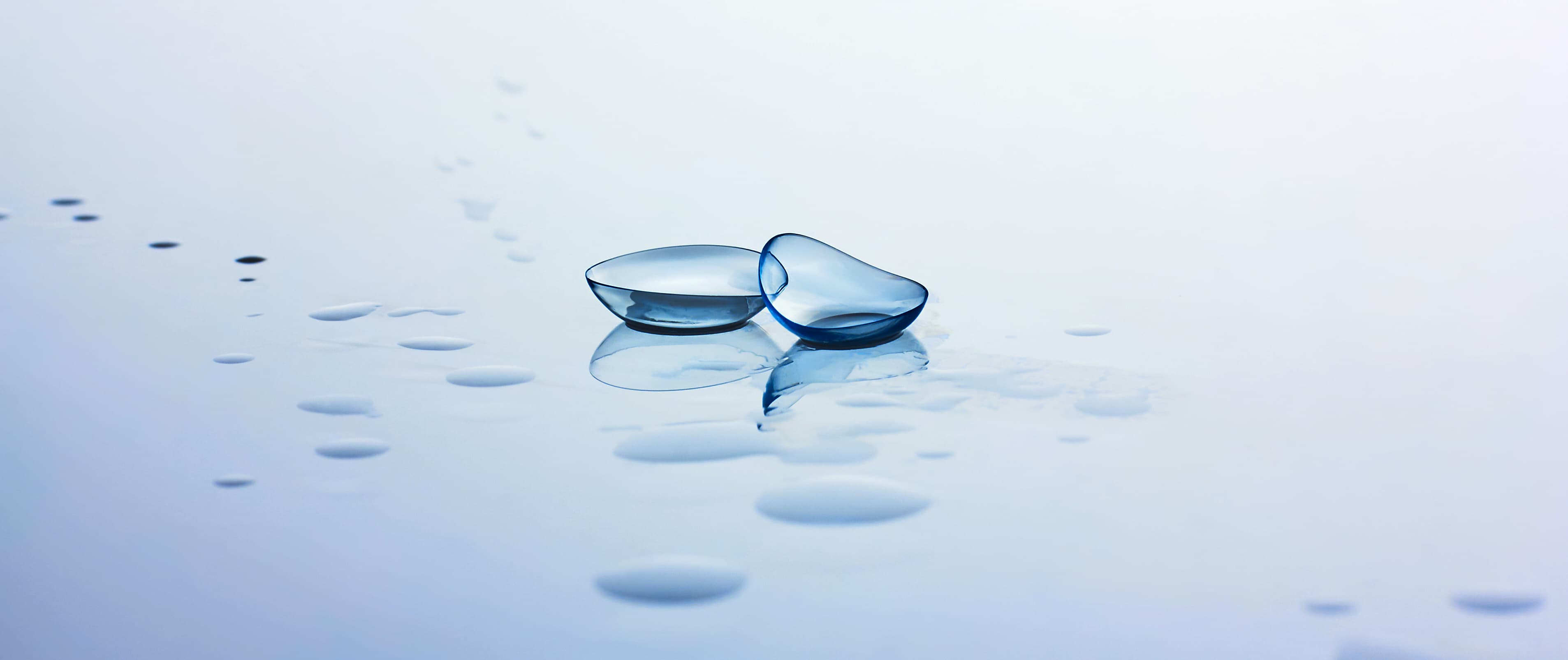 Hybrid contact lens held on a fingertip before insertion