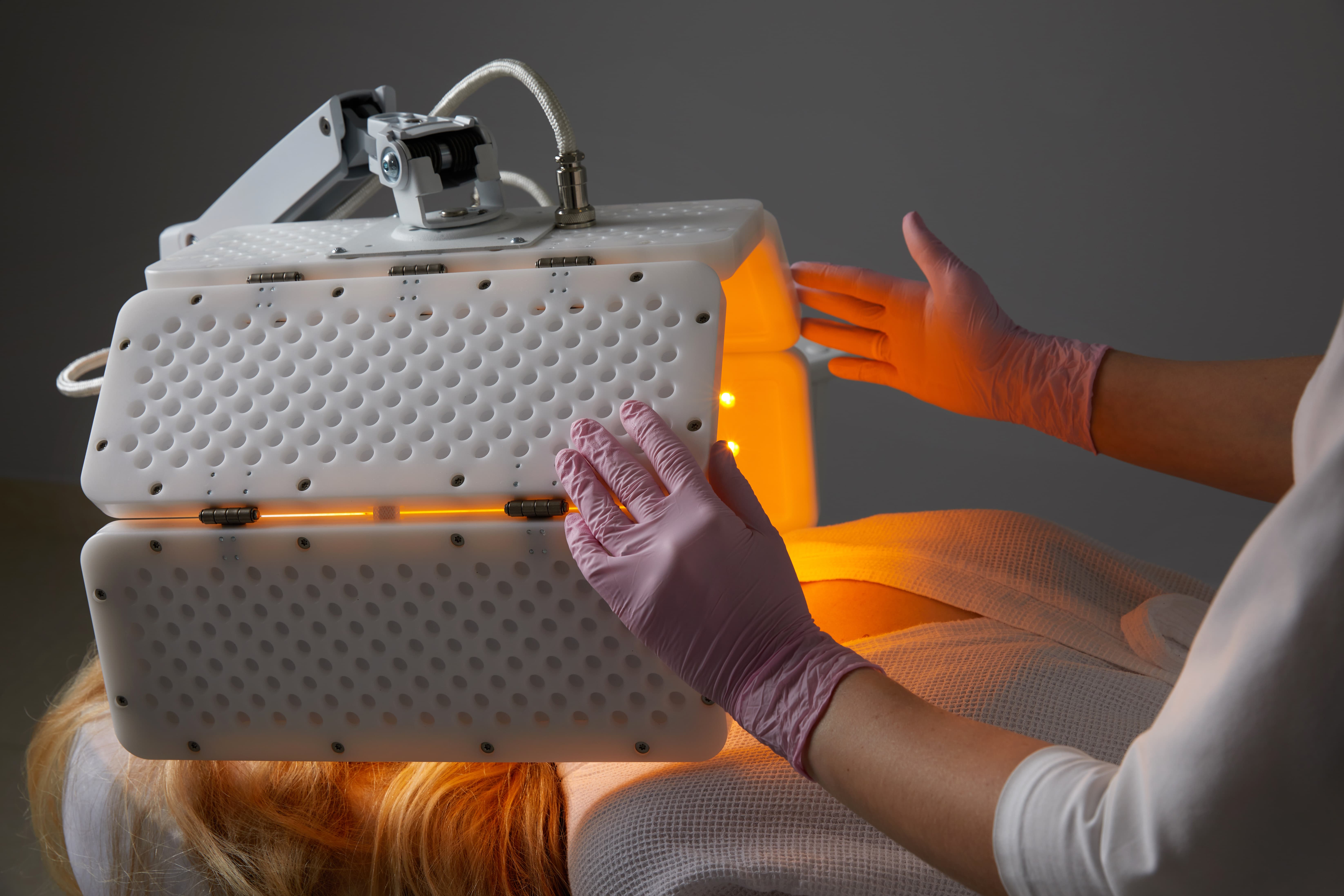 Patient receiving low level light therapy for dry eye relief