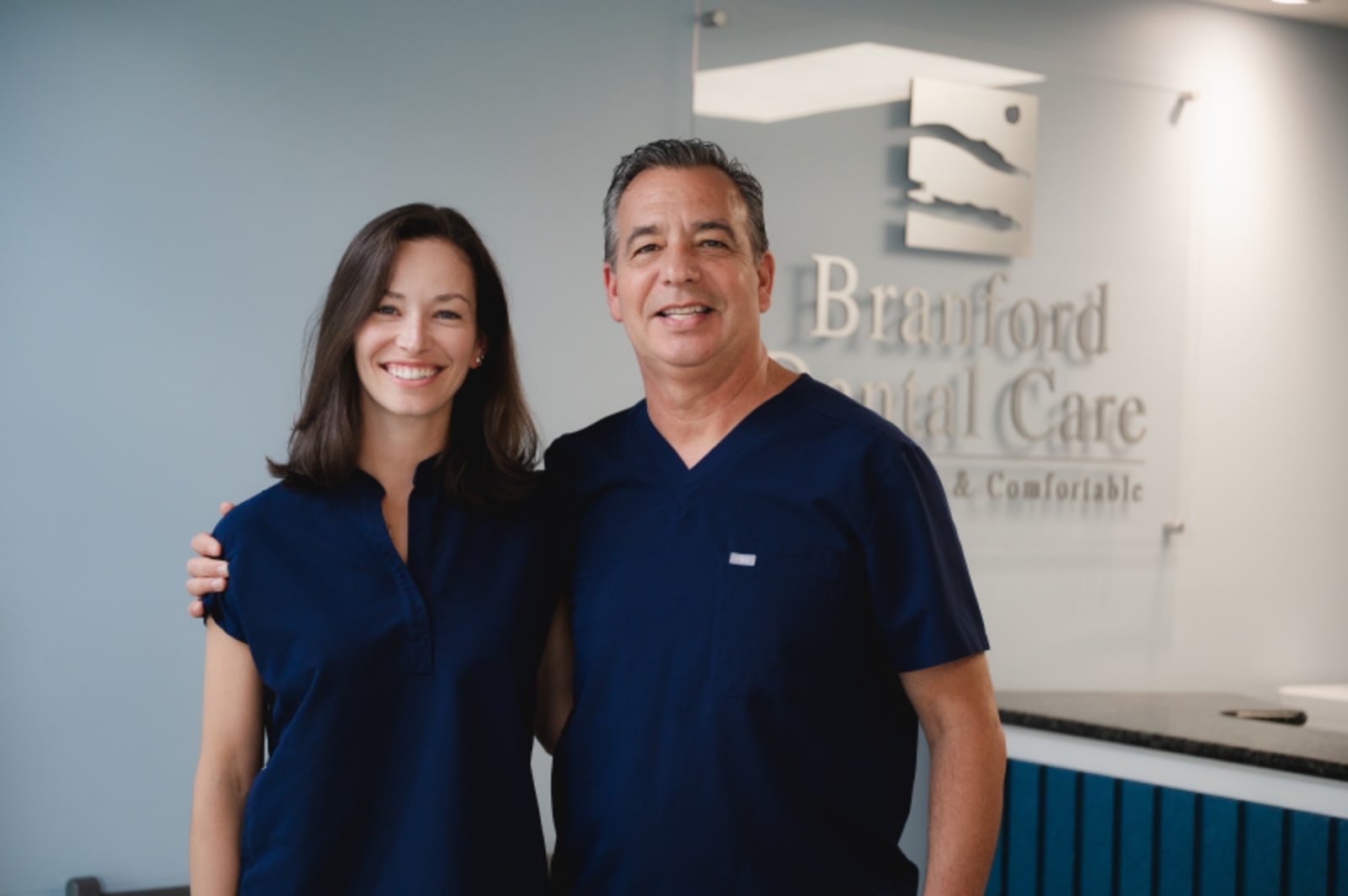 Branford Dental Care team members posing together in office