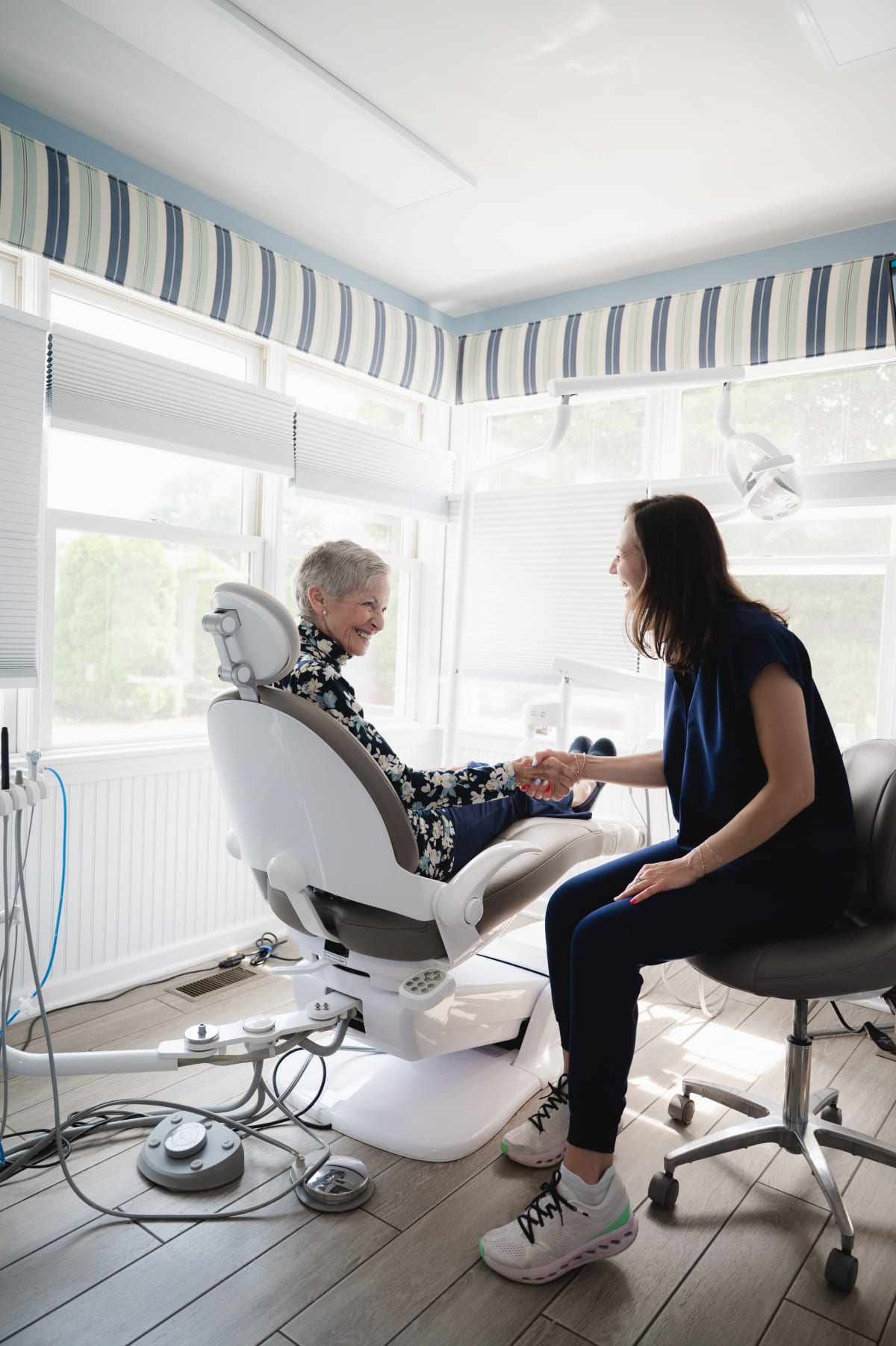 Dentist performing periodontal examination on patient in treatment chair