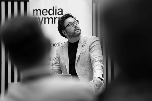 Picture of Will Humphrey giving talk on R&D at media cymru event 