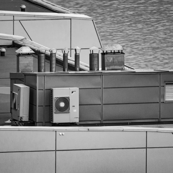 Rooftop mechanical equipment and flue stacks on a commercial building