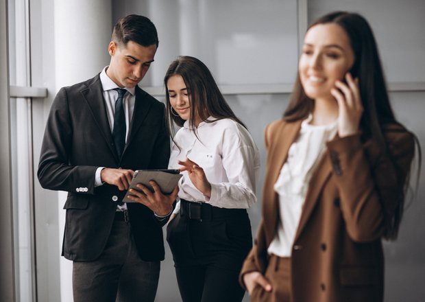 Business professionals reviewing a tablet