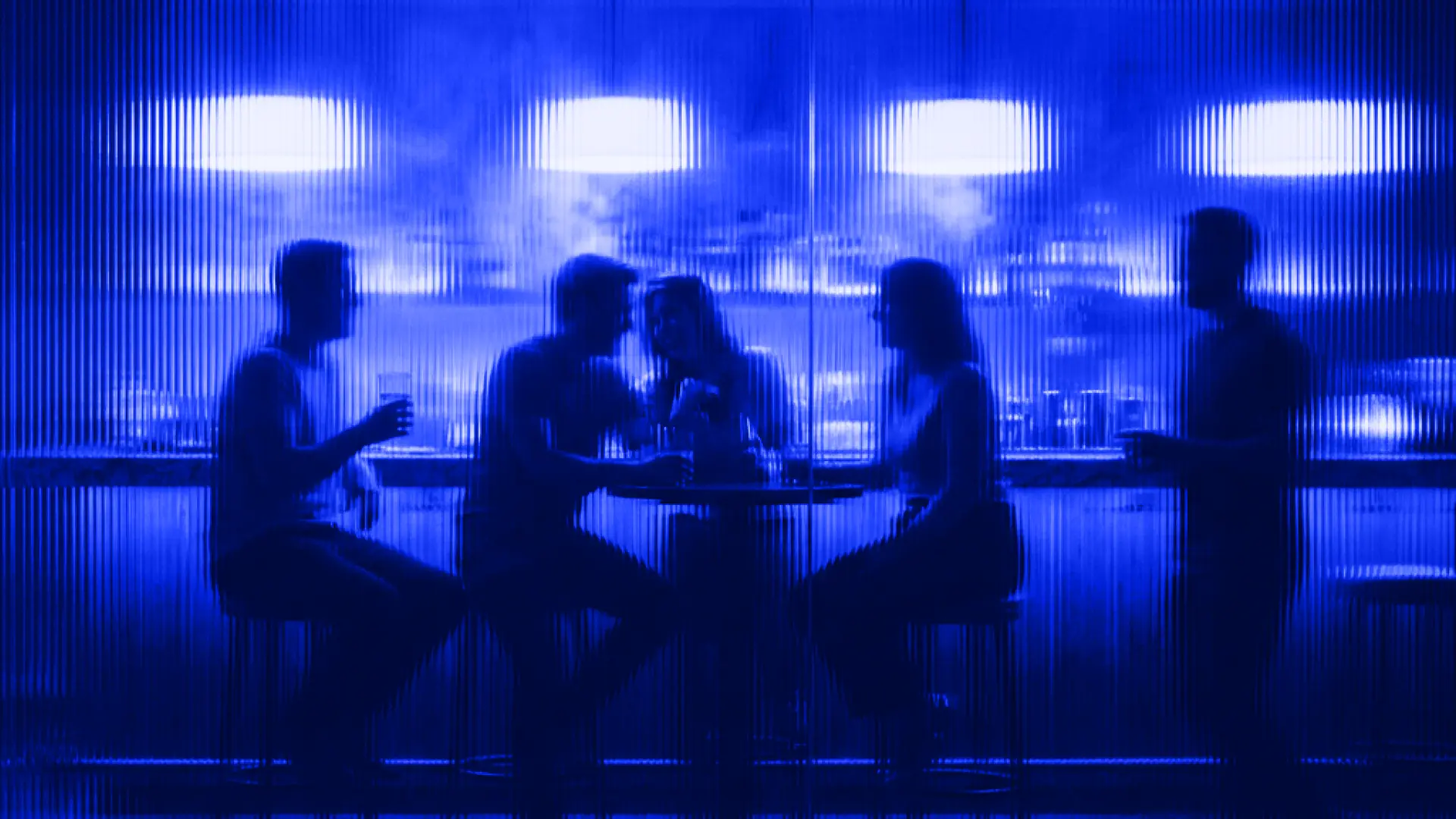 People with drinks at the bar at Plunged, recovery studio in Gent
