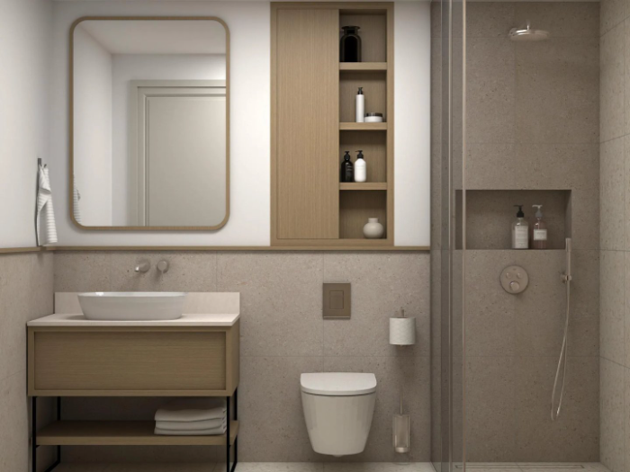 Bathroom with a vanity, mirror and walk-in shower