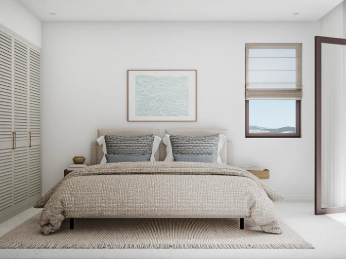 Bedroom with a double bed, shutters and framed artwork