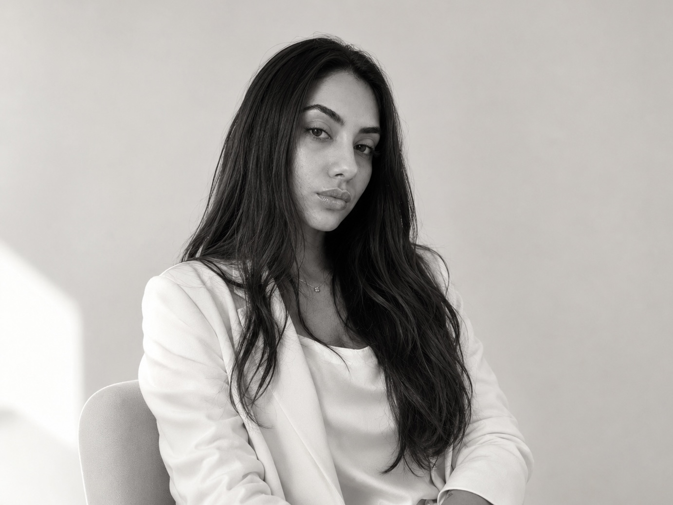 Black-and-white portrait of Hanita Manashirov, partner at Adria Estates