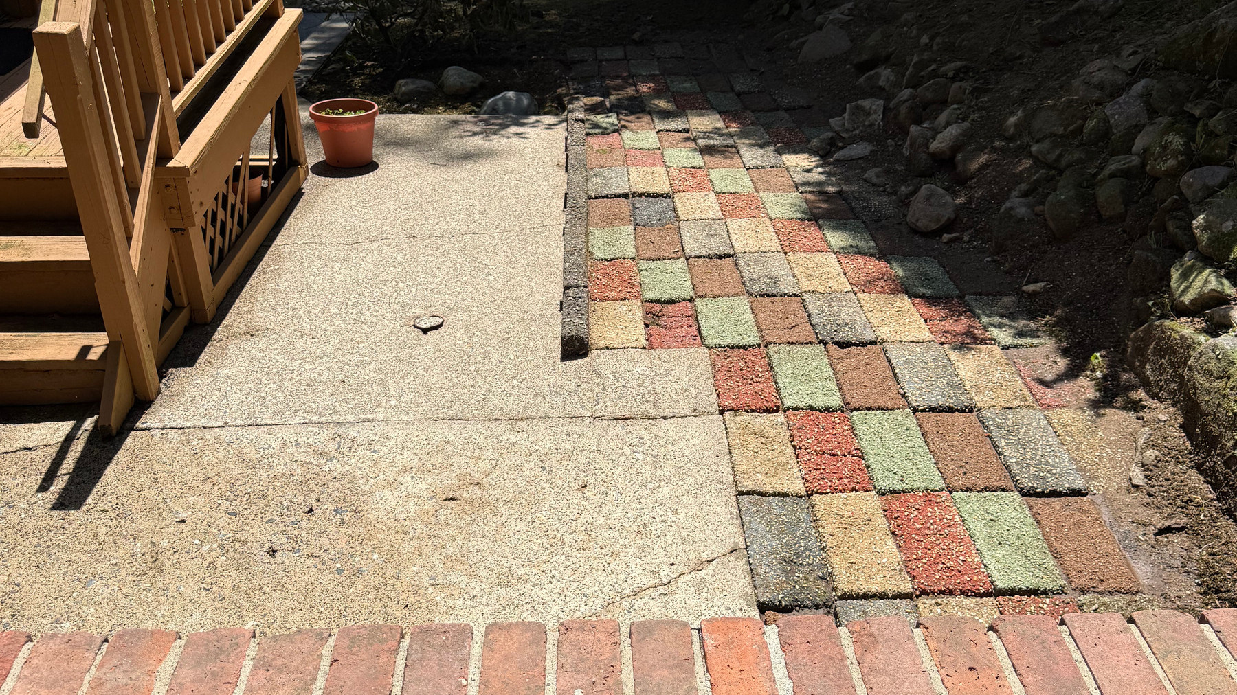 Concrete and brick patio after cleaning, back to bare stone