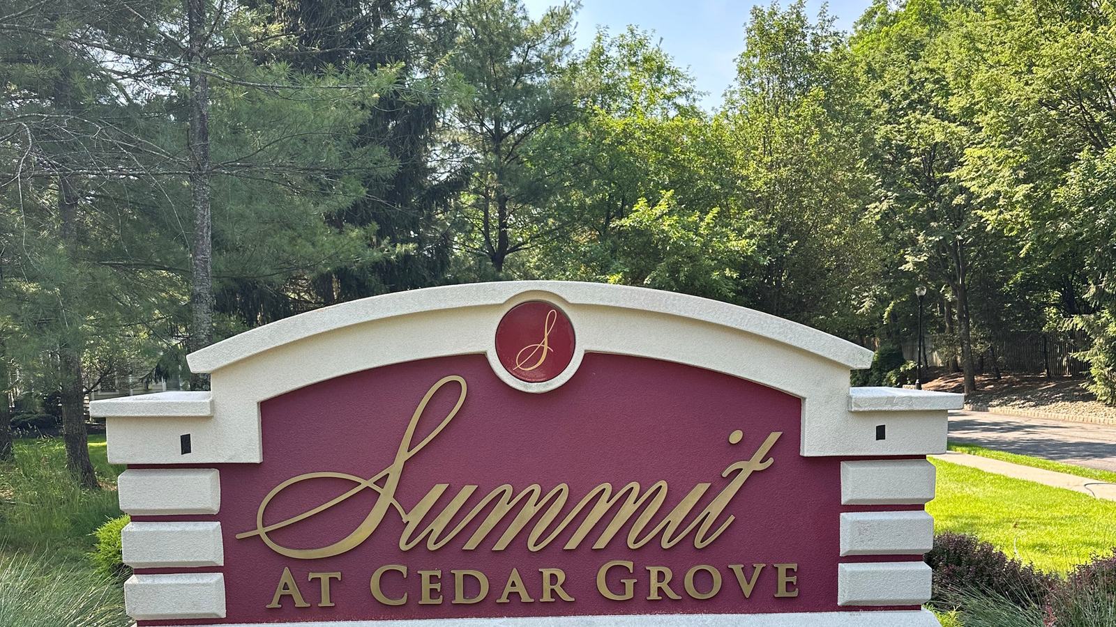 Stone and brick community entrance sign after cleaning, stonework bright again