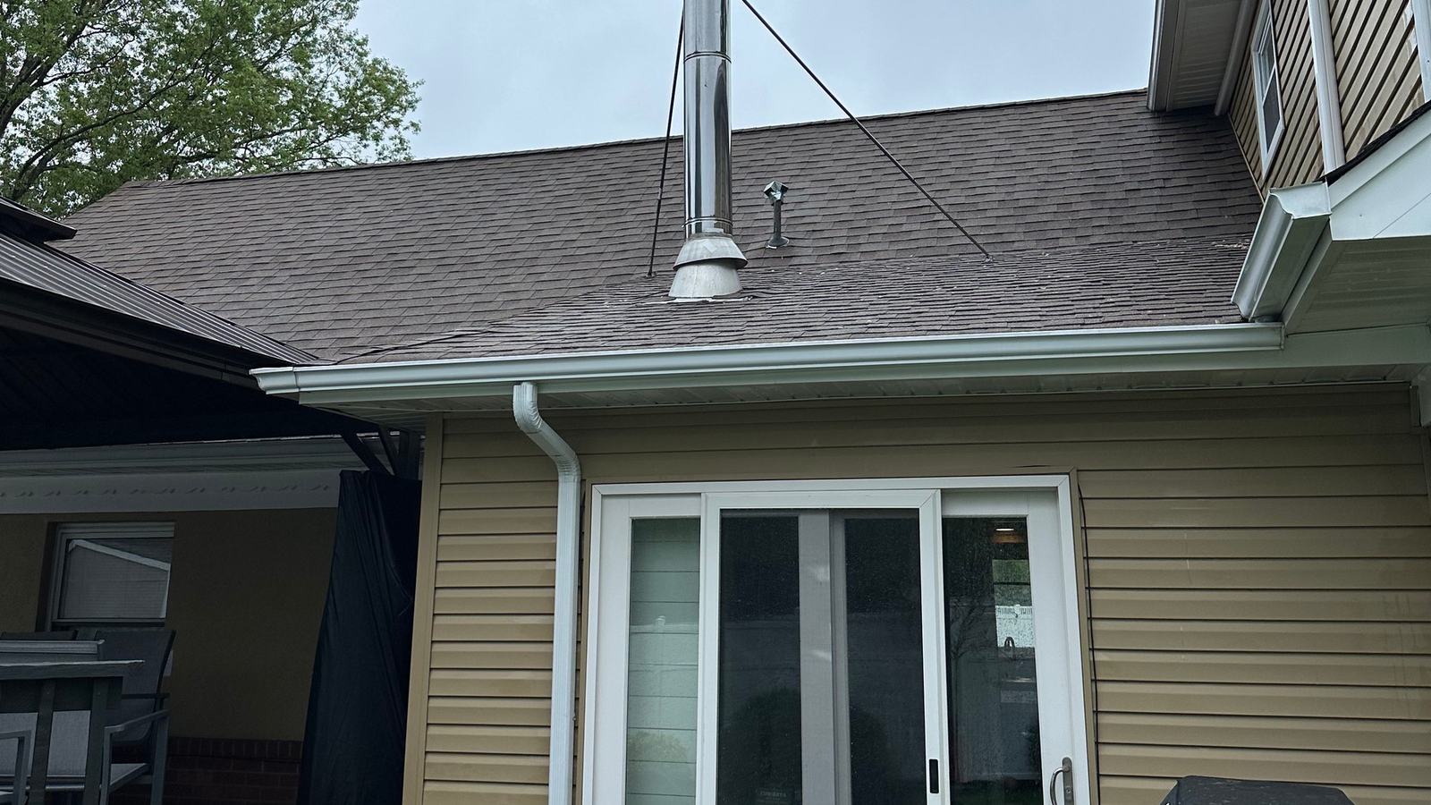 Clean siding, roofline and downspout on a Passaic County home after washing
