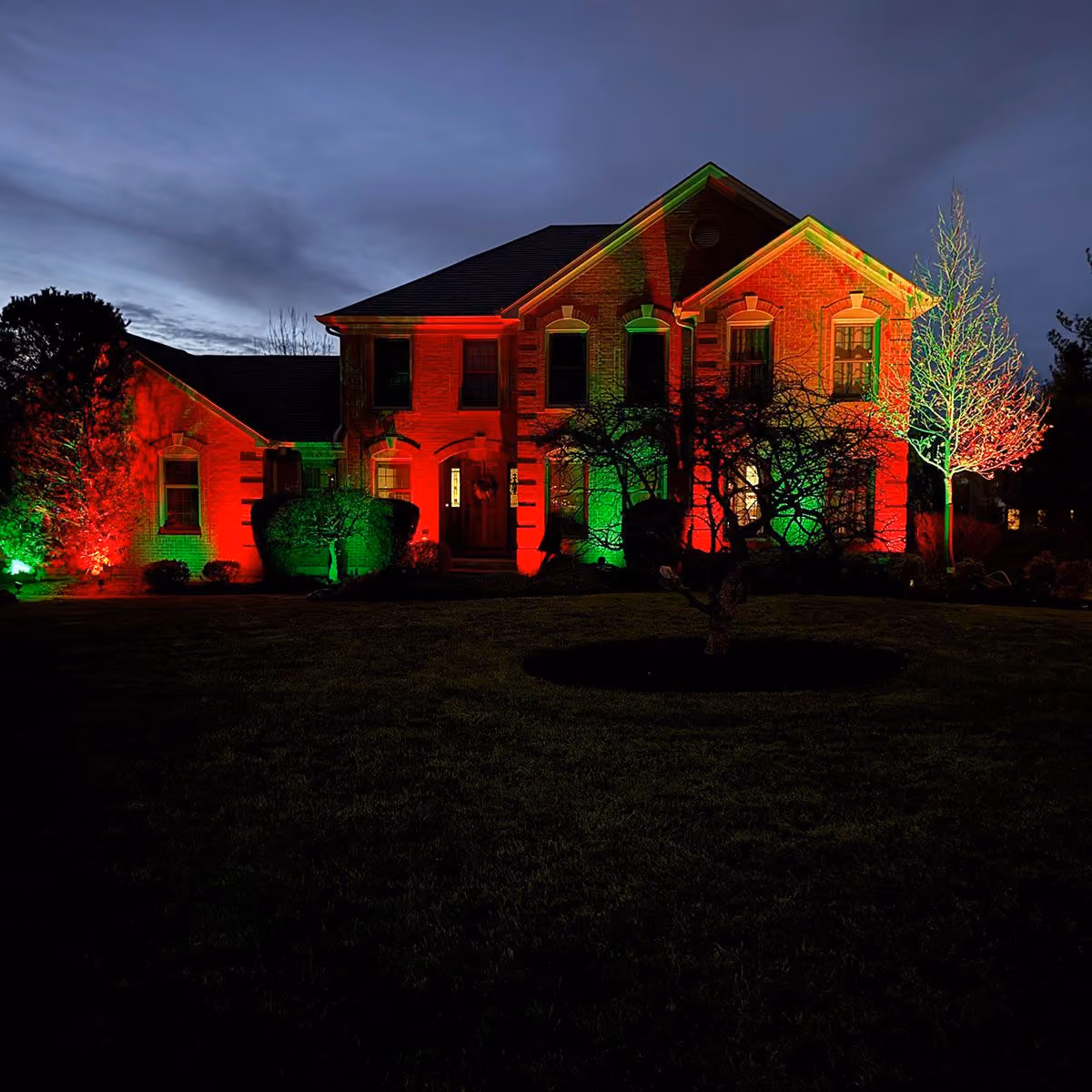 Triscapes professional Christmas lighting installation near me creating a bright, festive display for a beautifully decorated property.