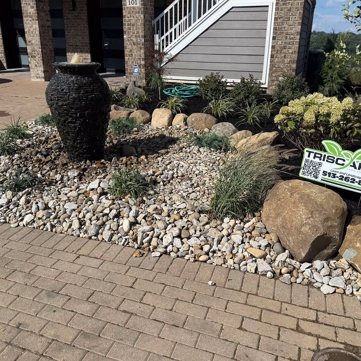 Triscapes professional landscaping near me featuring beautifully designed plant beds and shrubs
