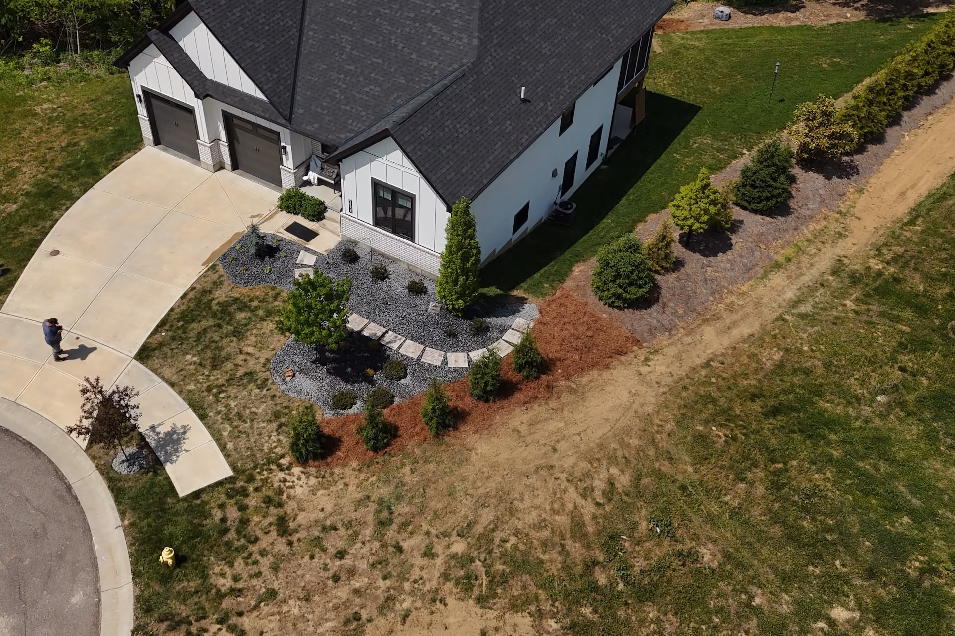 Professional weed control and seasonal cutbacks for healthy landscape beds