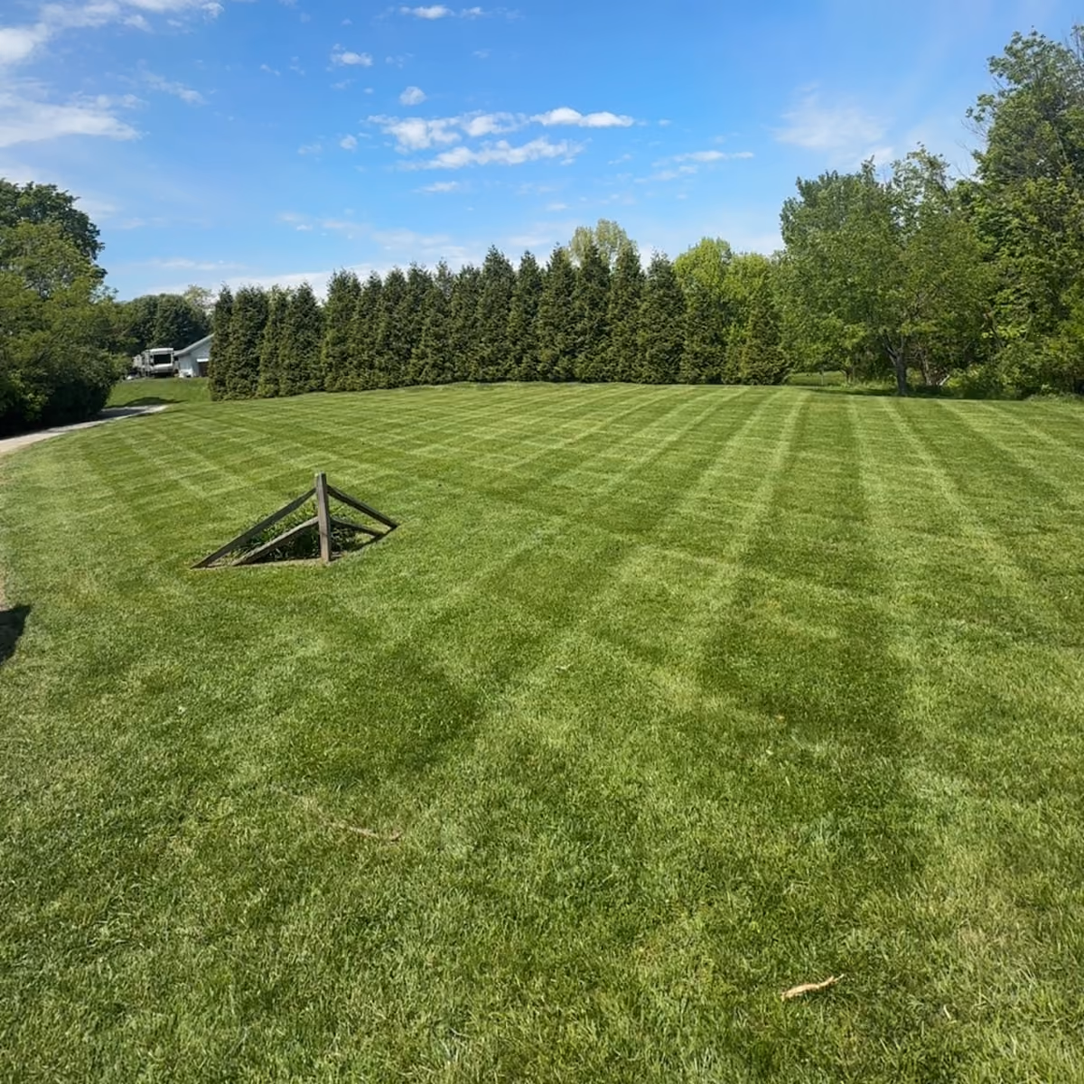 Weekly lawn mowing, edging, and cleanup by Triscapes for residential properties