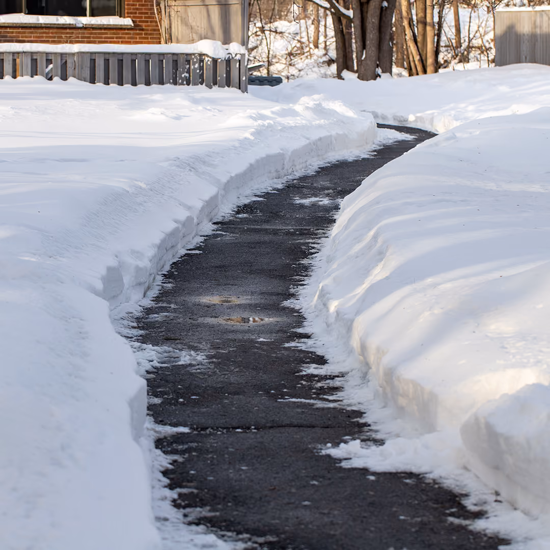Professional driveway snow plowing and winter property clearing by Triscapes