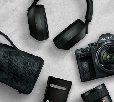 Assorted Sony products including headphones, speakers, camera equipment, and accessories arranged in a flat-lay composition representing email and lifecycle marketing design work.