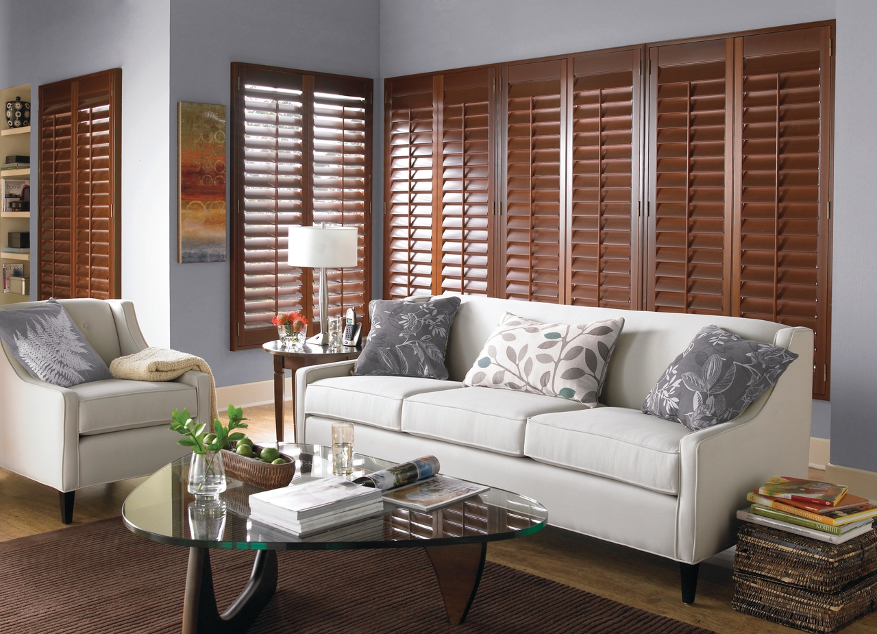 Custom wood interior shutters in a bedroom