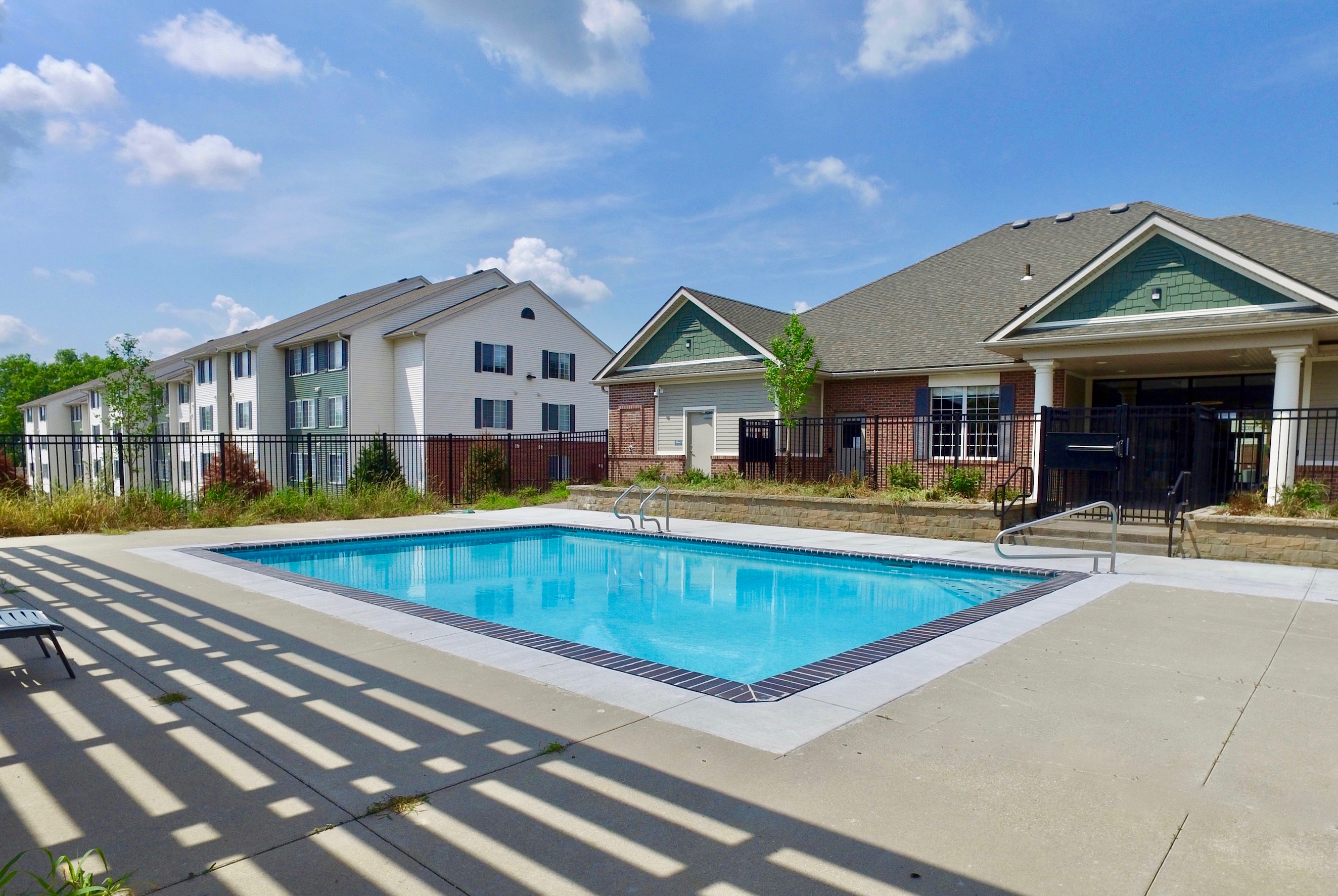 Pool with apartment backgrounds in the back