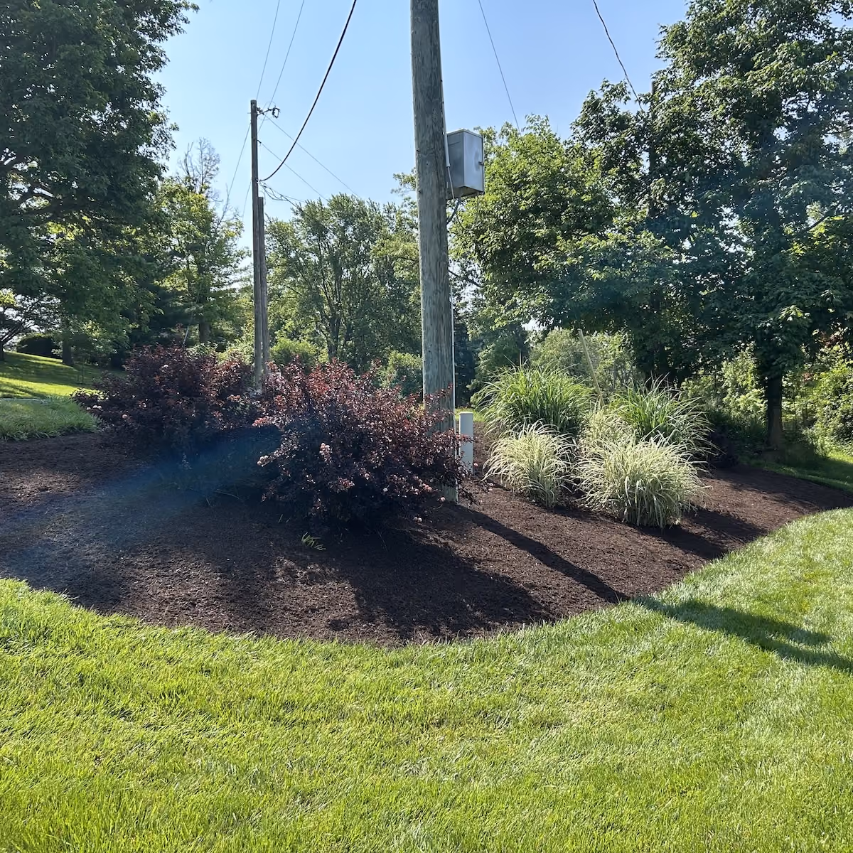 Fresh mulch installation for residential landscape beds by Howie’s Lawn Care LLC in West Jefferson, Ohio