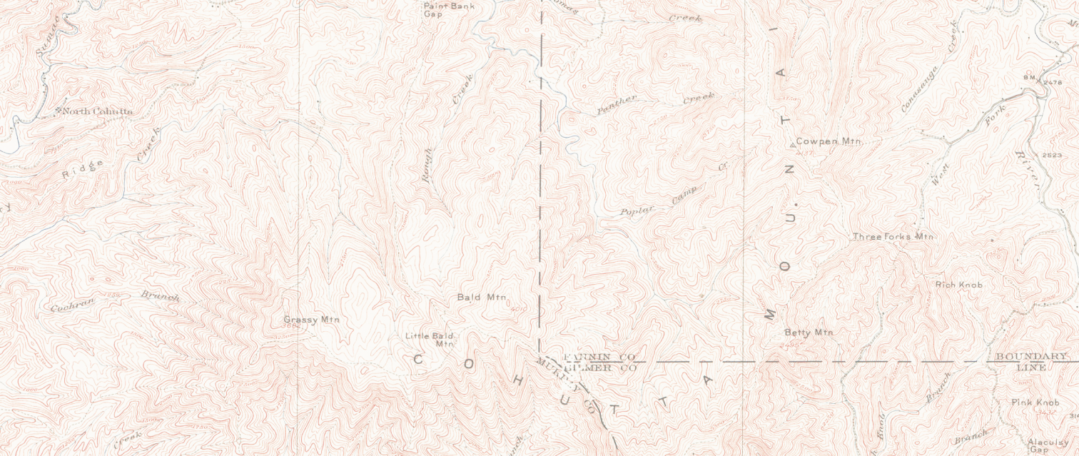 Topographic map showing contour lines, mountain names, rivers, and boundary lines across rugged terrain.