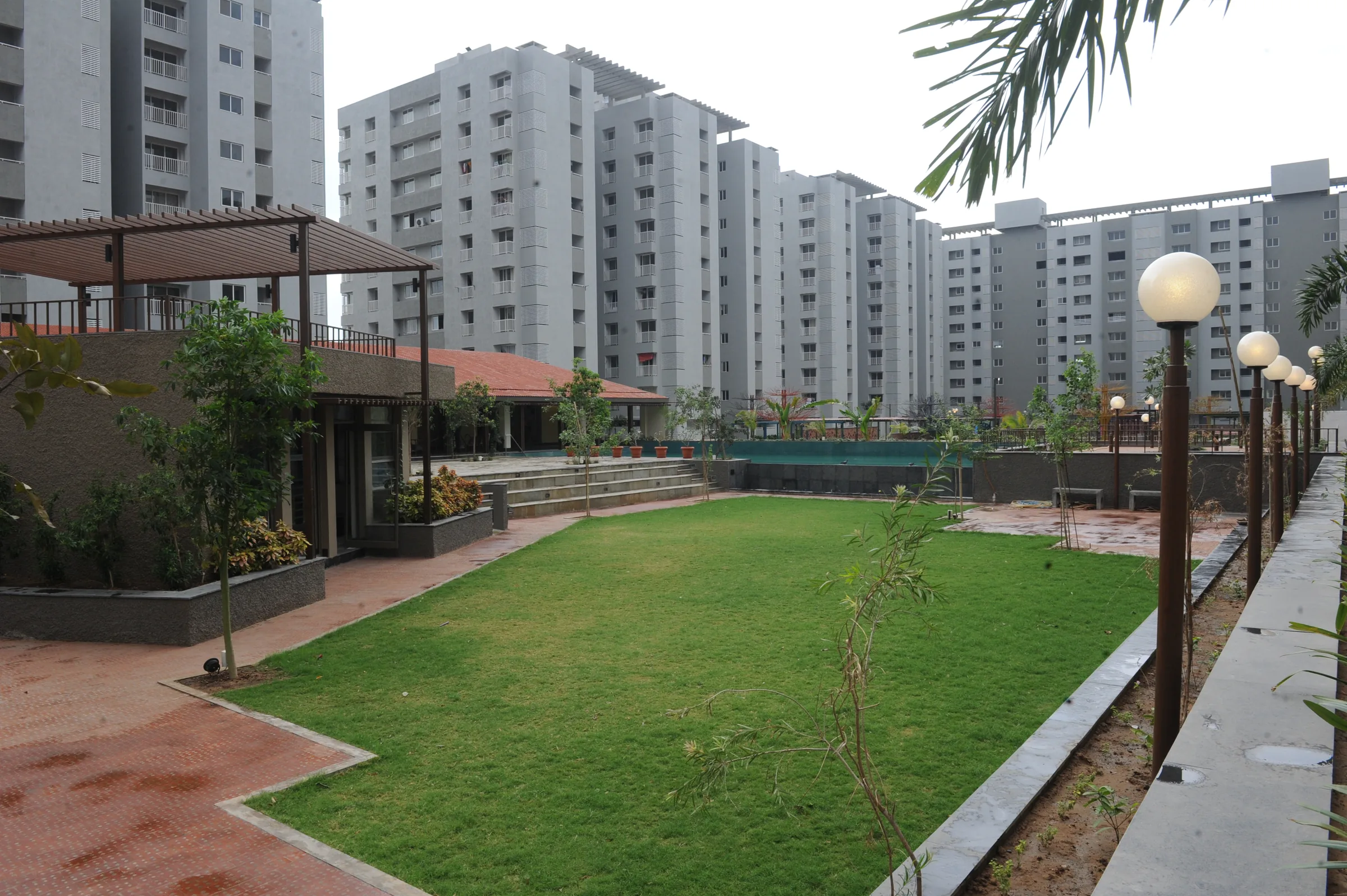 Samsara landscaped lawn with the residential towers behind