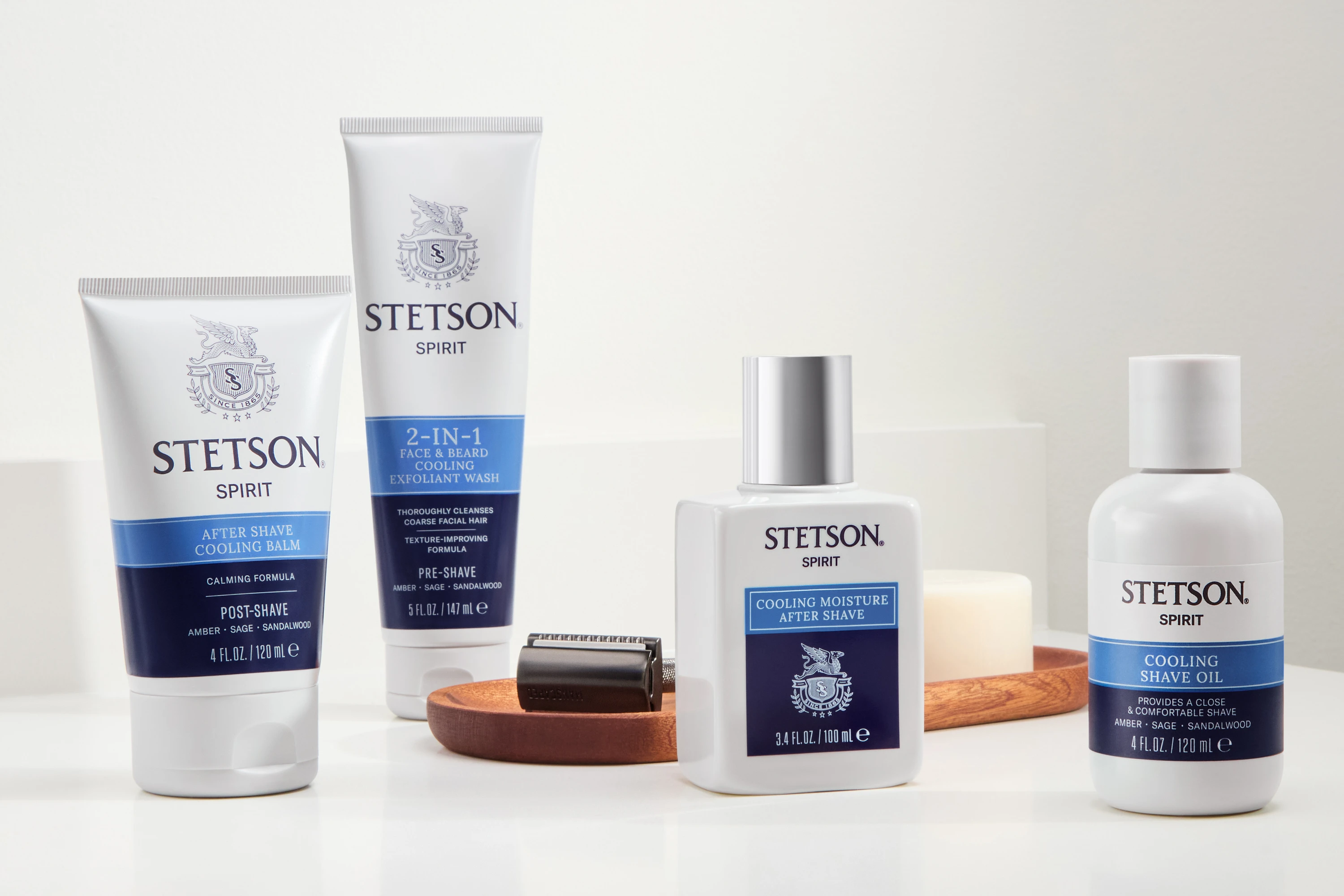 A group of Stetson grooming products on pale platforms.