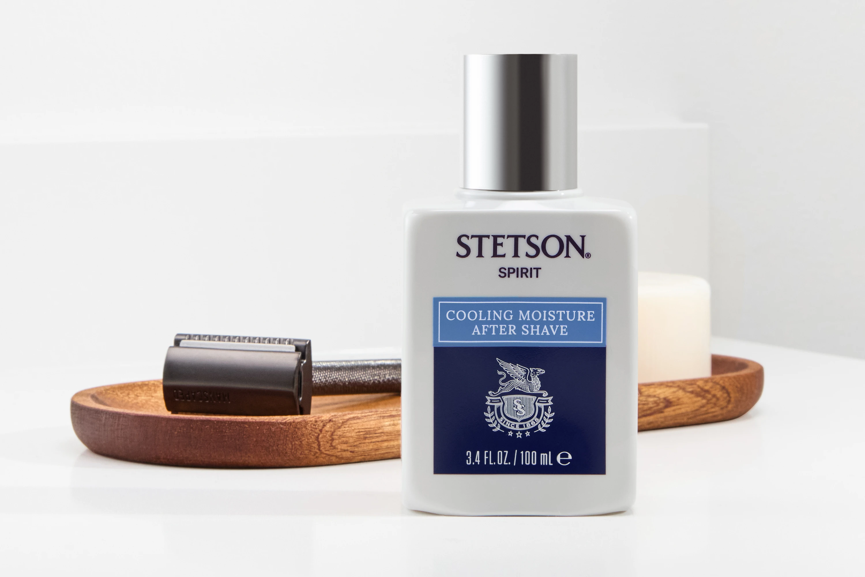A Stetson aftershave bottle beside grooming accessories.