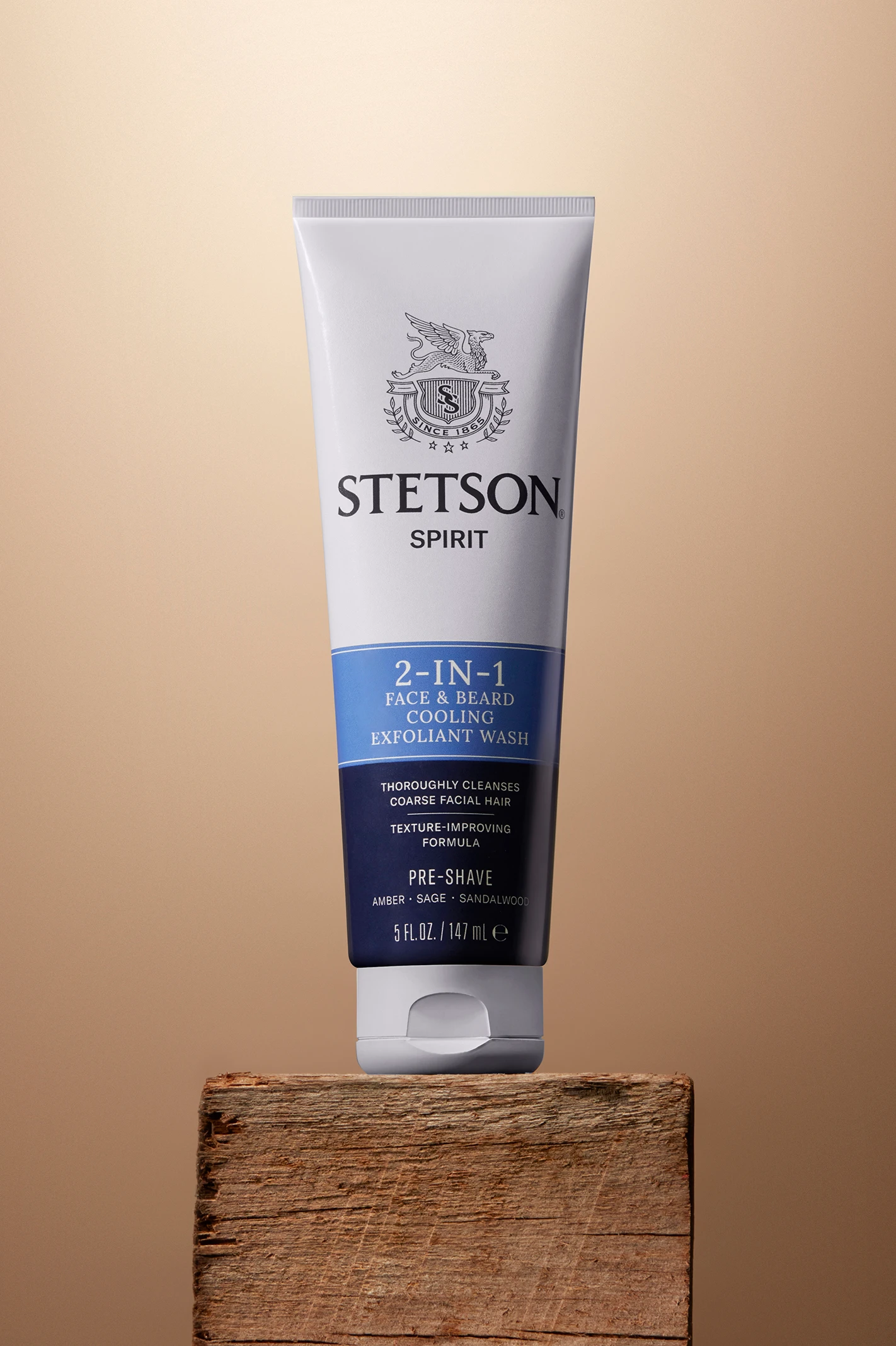 A Stetson tube standing on a wooden block.