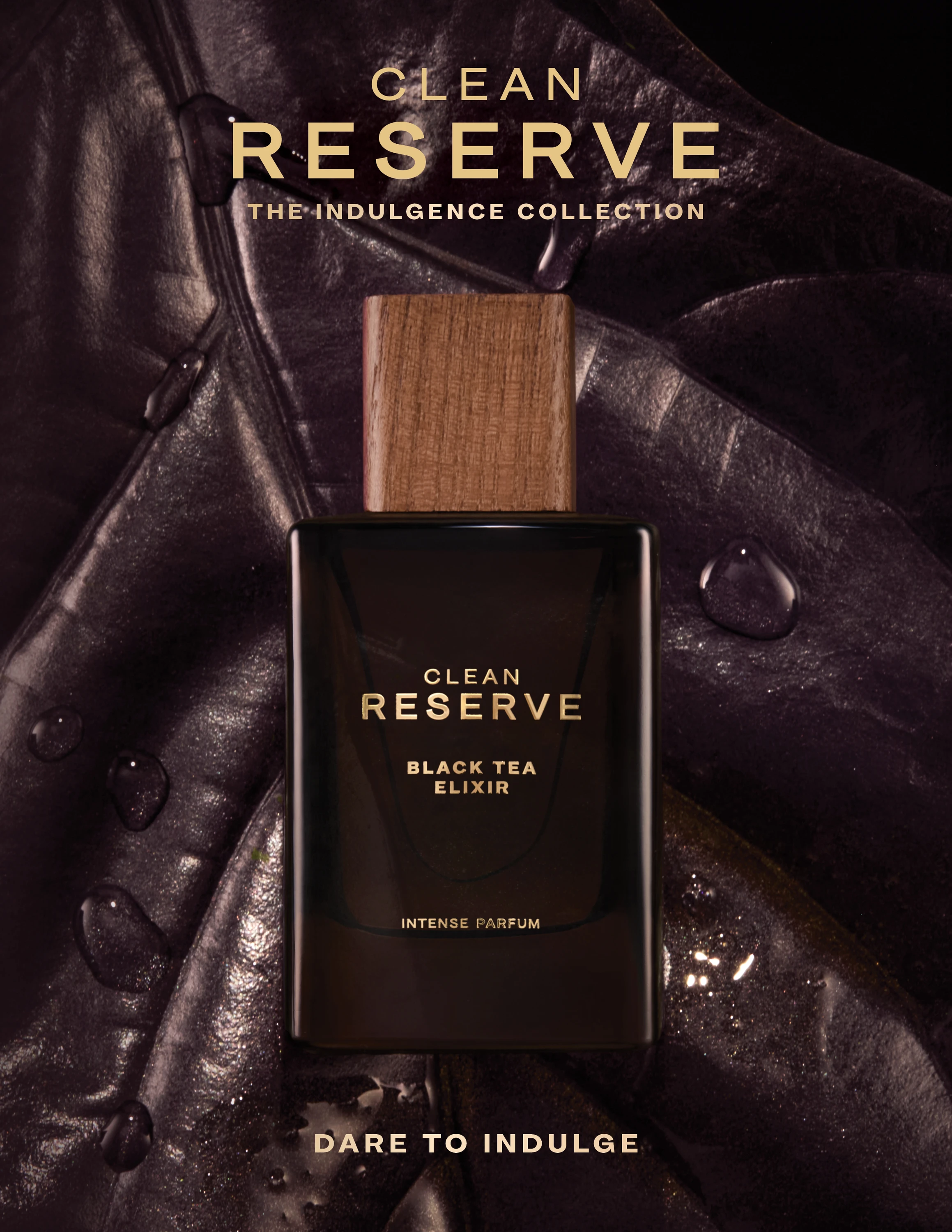 A dark Clean Reserve bottle against glossy folded fabric.