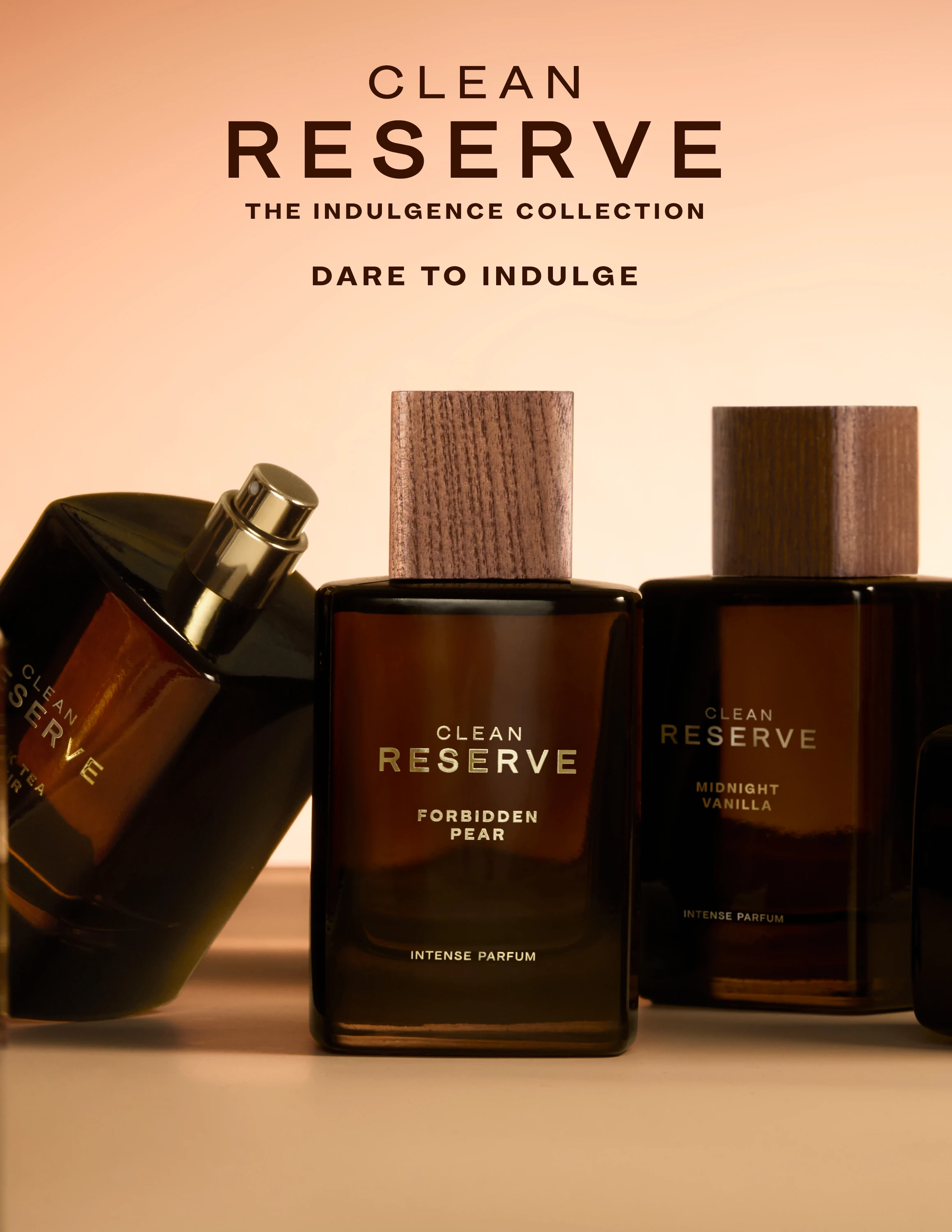 Clean Reserve Indulgence bottles arranged against a warm backdrop.