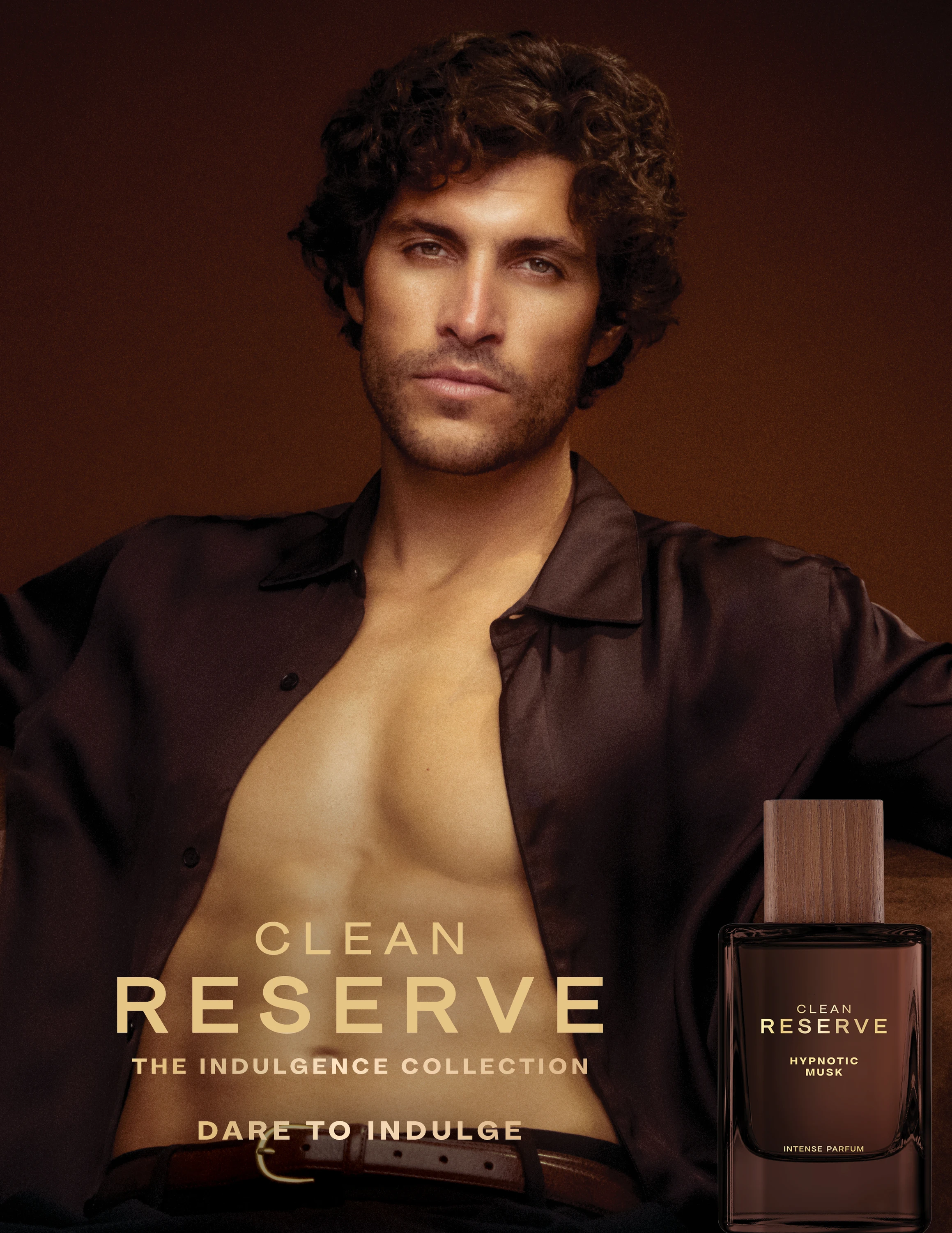 A model in an open dark shirt in Clean Reserve campaign artwork.
