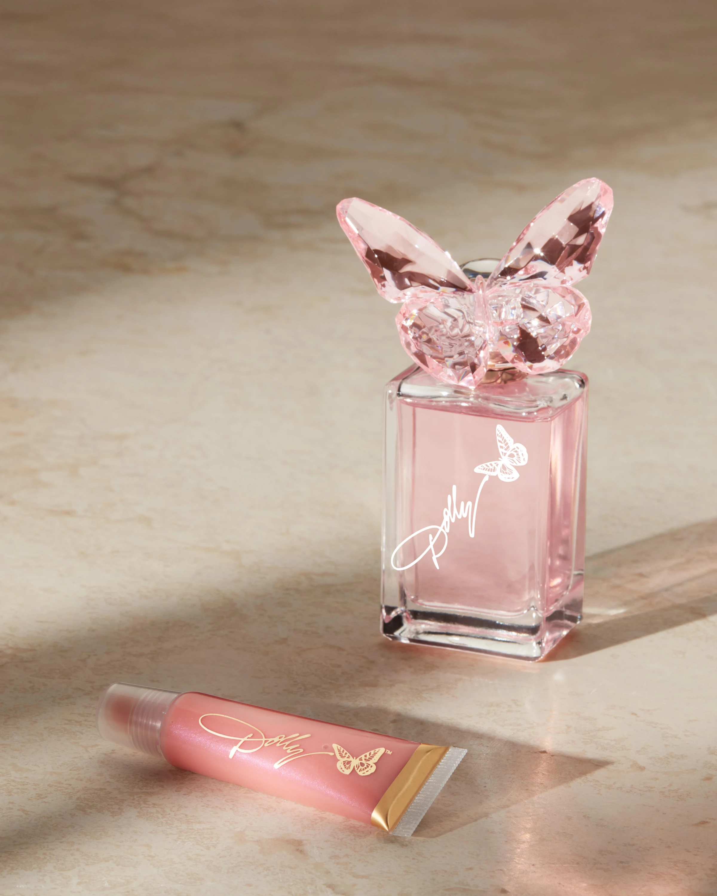 A Dolly Parton bottle and carton on a sunlit surface.