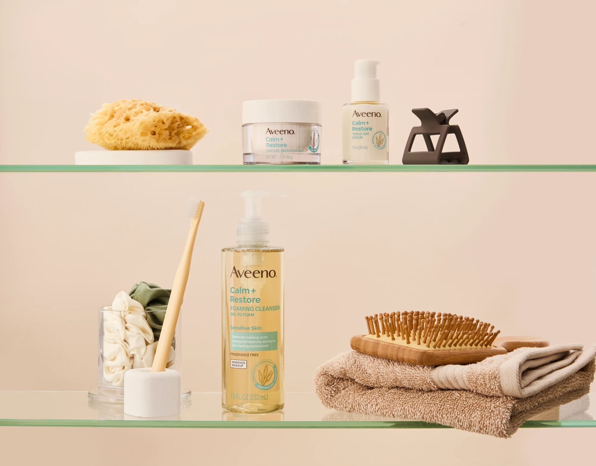 Aveeno products arranged on bathroom shelves.