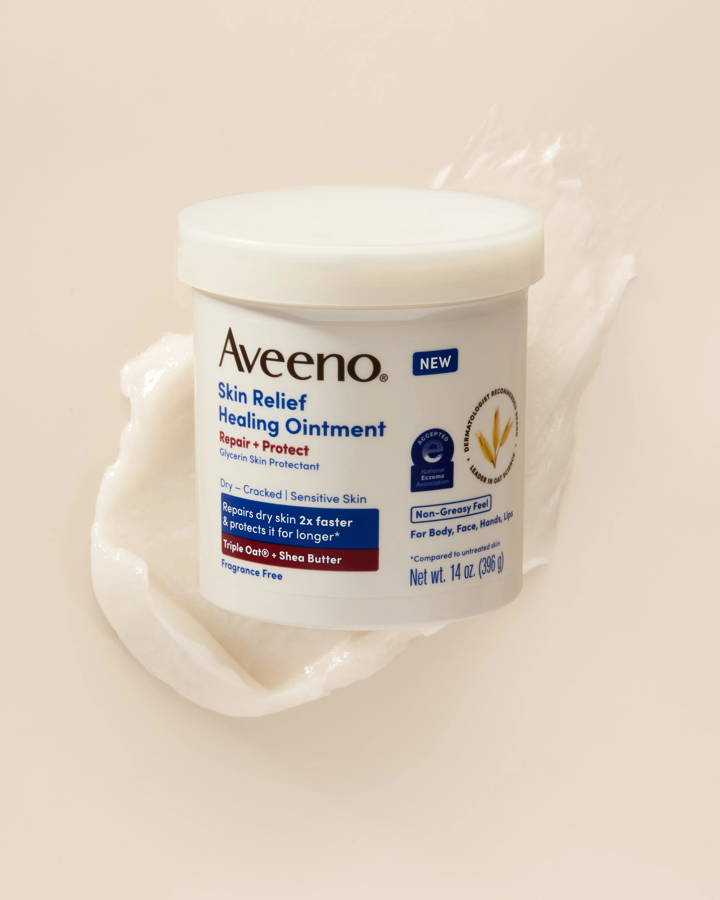 An Aveeno jar resting on a swirl of cream.