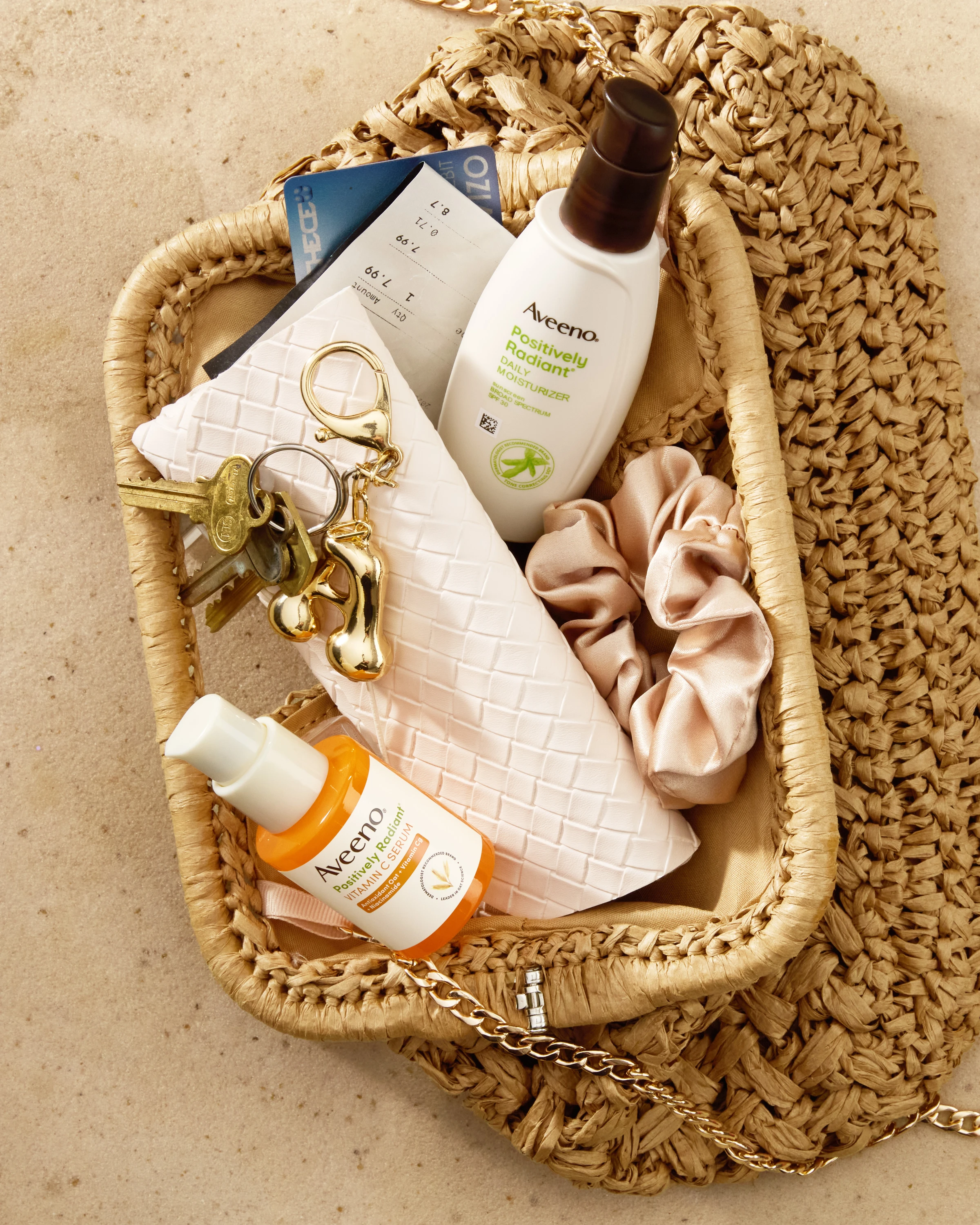 Aveeno products arranged in a woven basket.