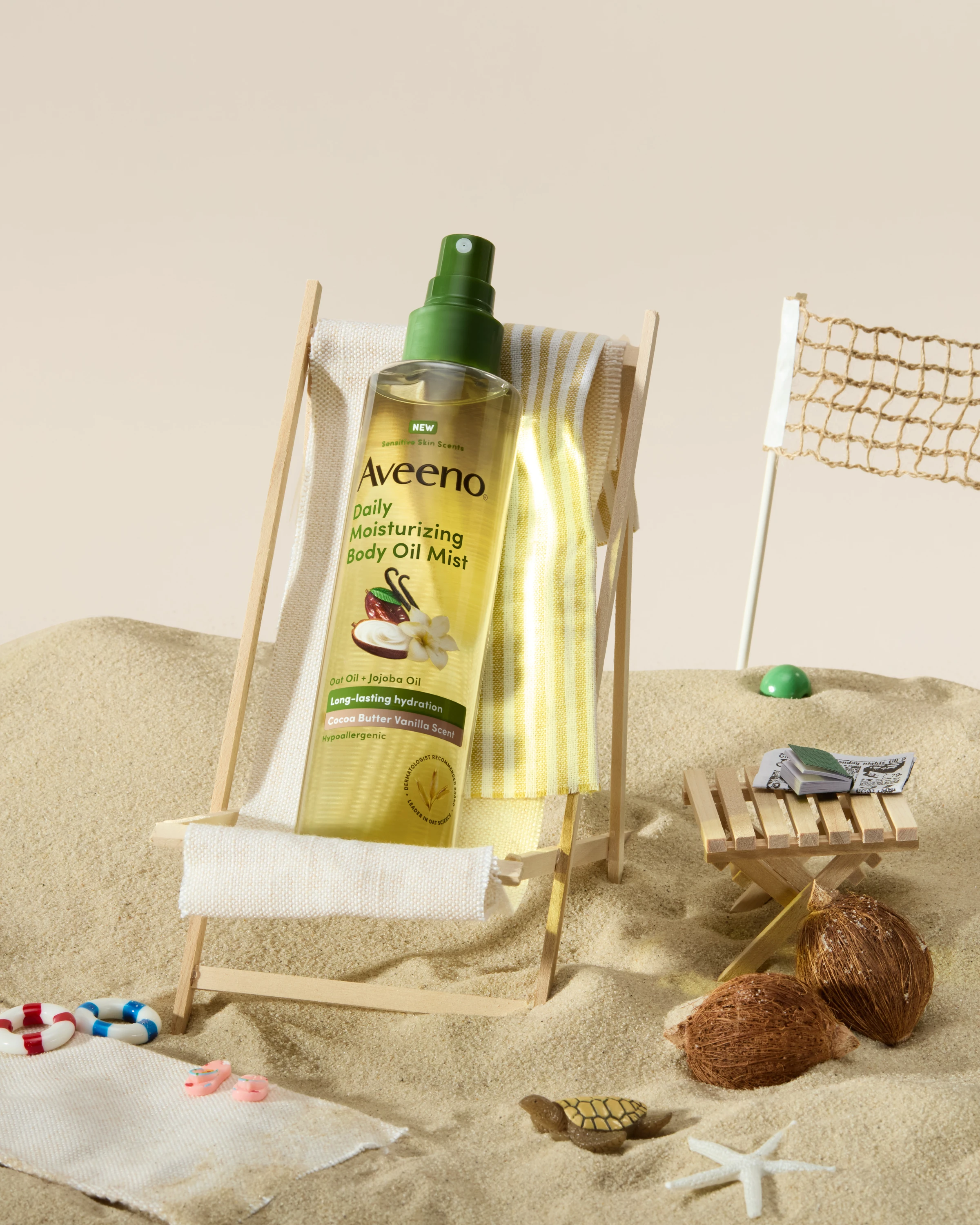 An Aveeno oil bottle inside a transparent bag with beach accessories.