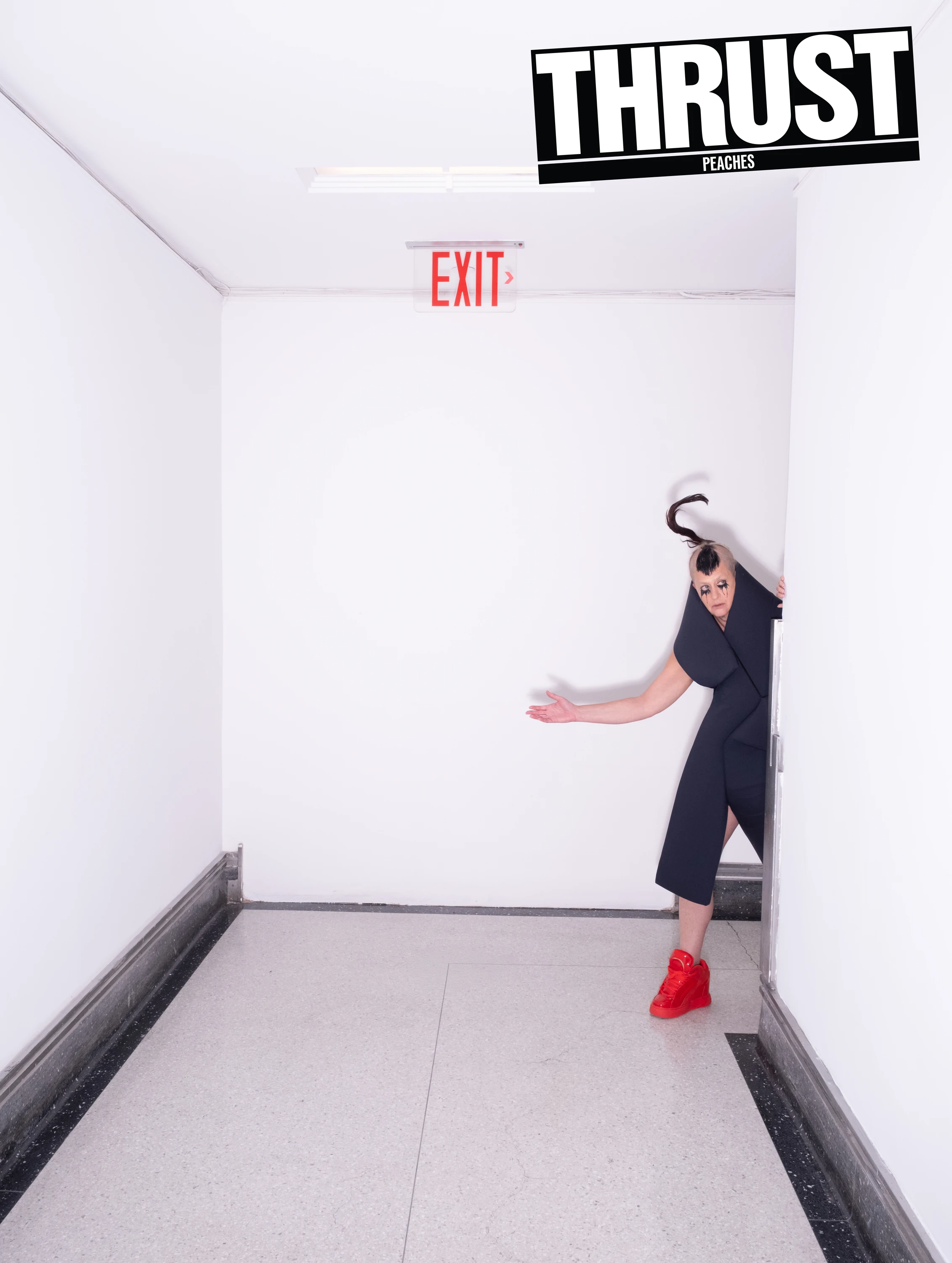 THRUST cover featuring Peaches leaning into a hallway.
