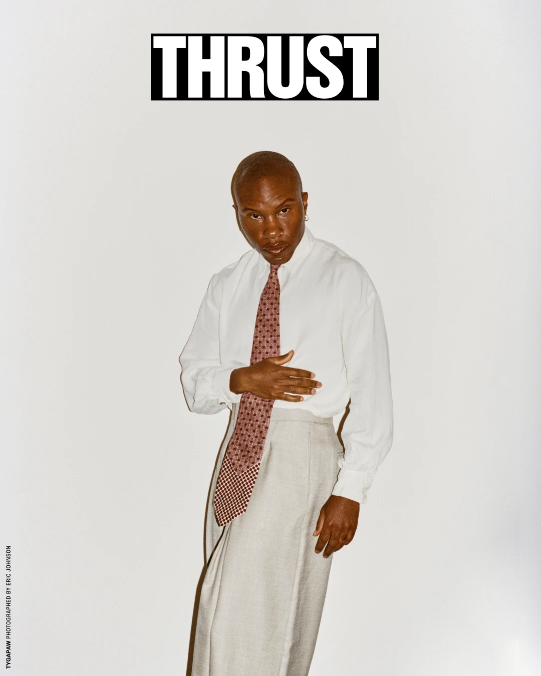 Alternate THRUST cover featuring TYGAPAW in a pale shirt.