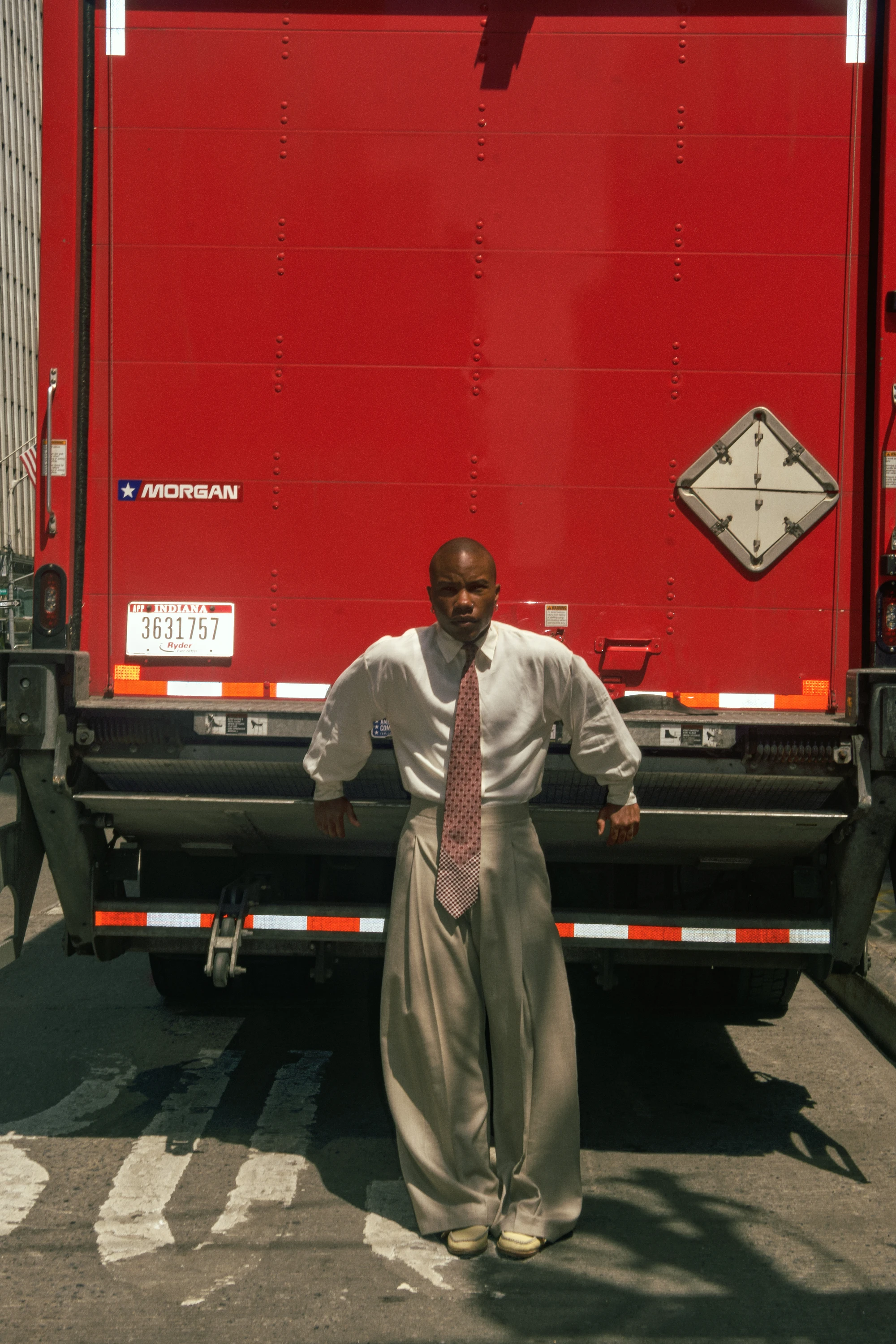 TYGAPAW posing in front of a red truck.