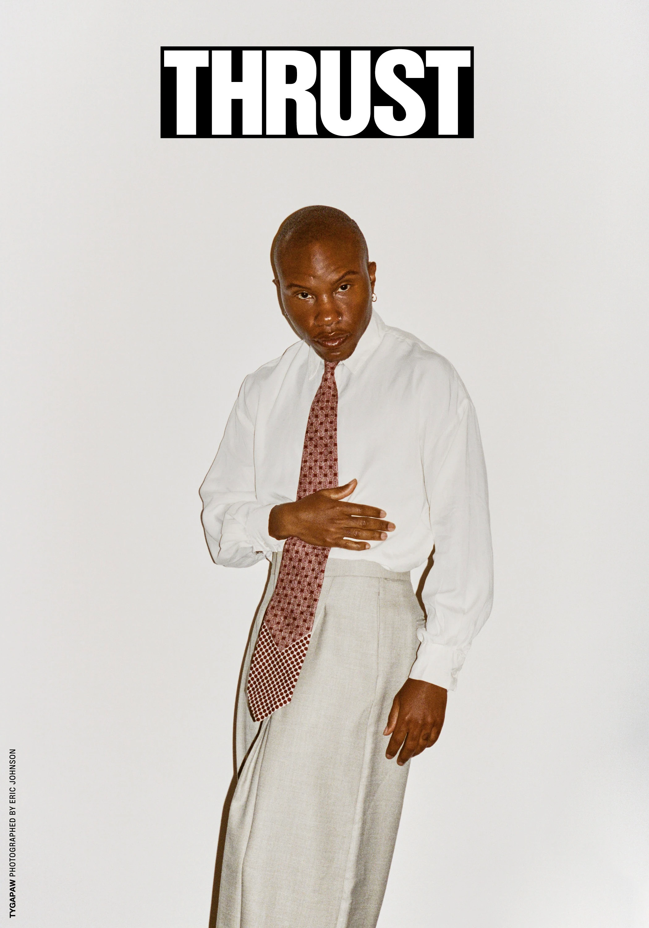 THRUST cover featuring TYGAPAW in a pale shirt.