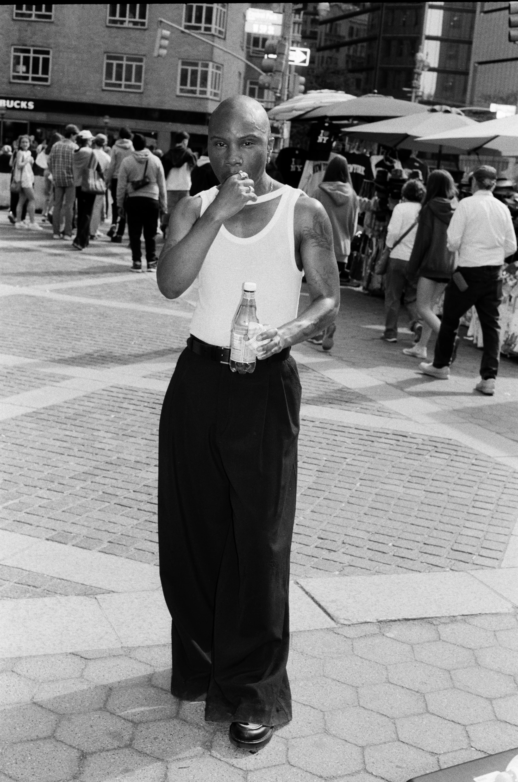 TYGAPAW standing in a busy public square.