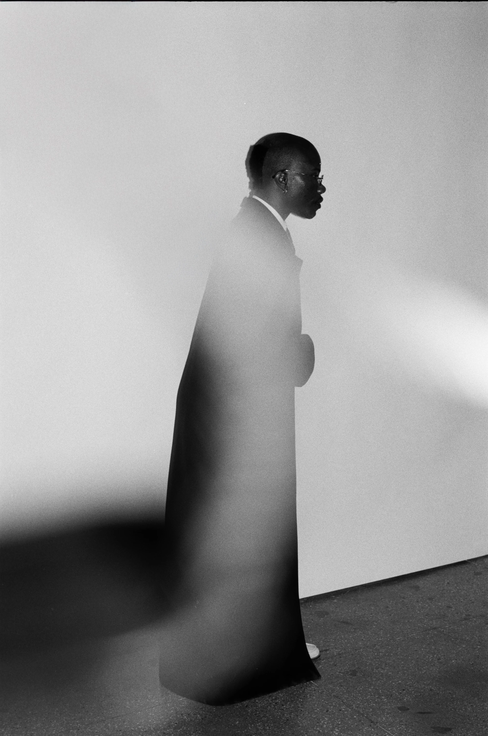Black-and-white motion-blurred profile of TYGAPAW.