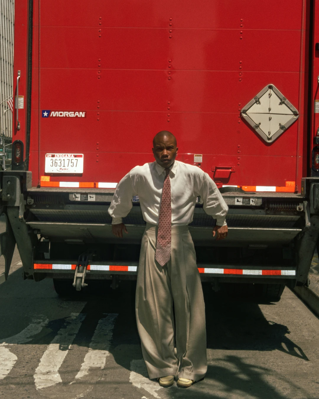 TYGAPAW standing in front of a red truck in an editorial layout.