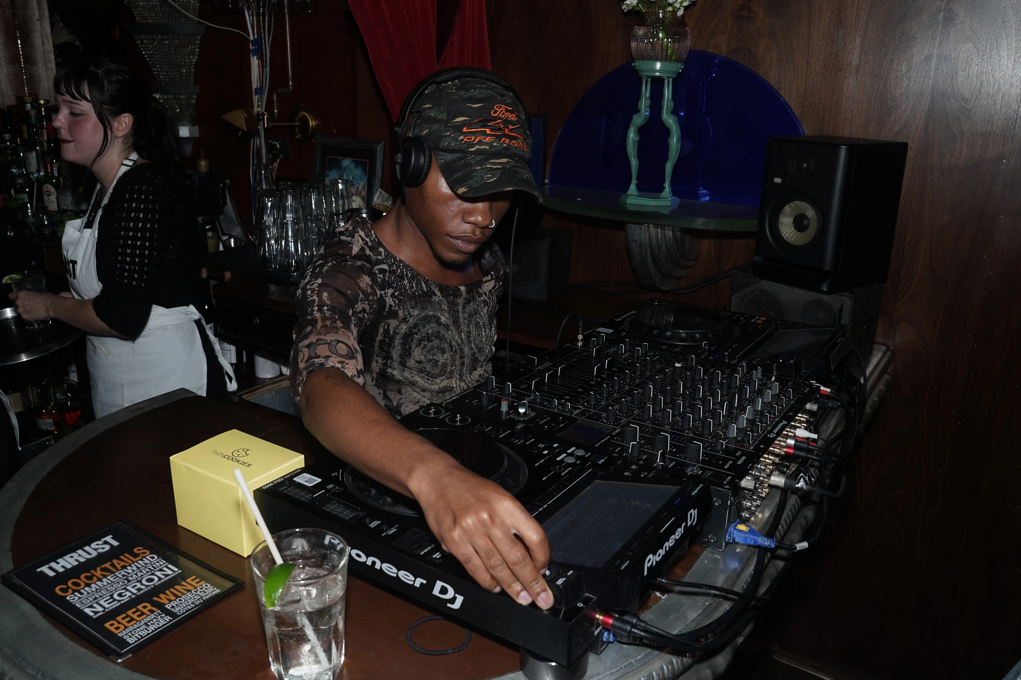 A DJ operating a mixing console.