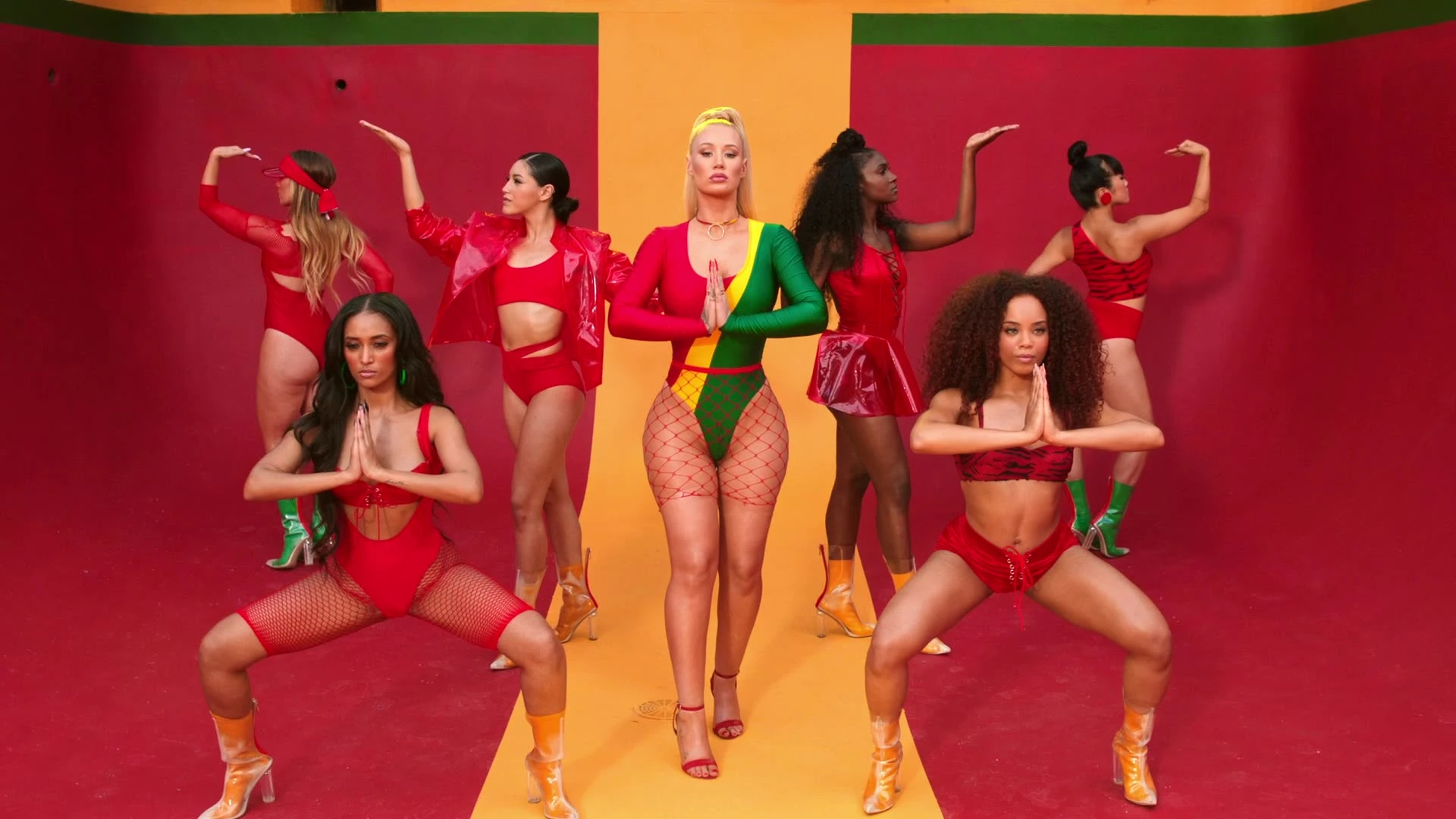 Iggy Azalea and dancers performing a synchronized routine.