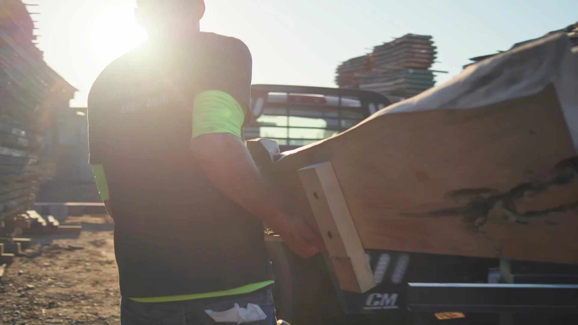 A worker moving materials outdoors.