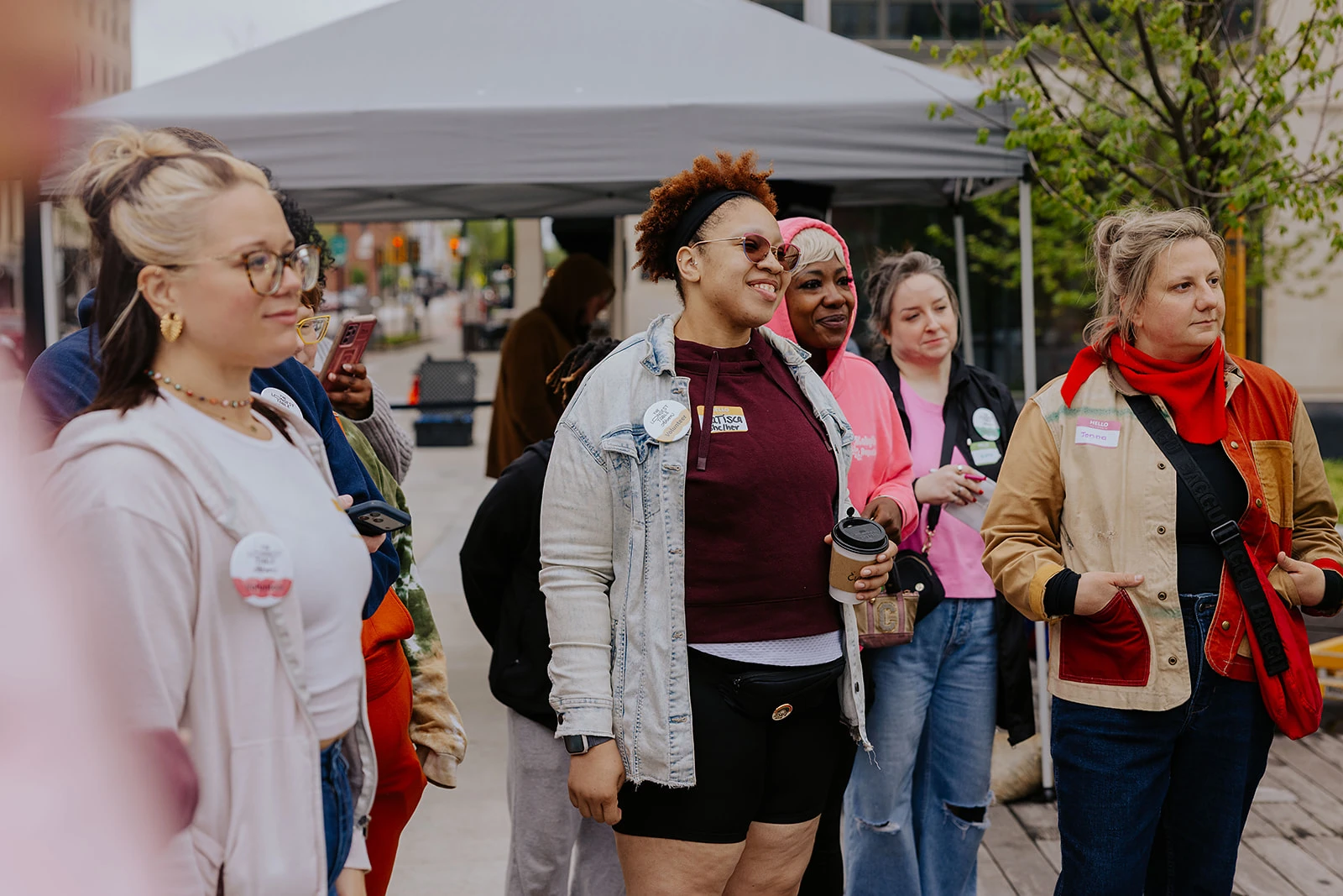 A group of participants singing together outdoors.